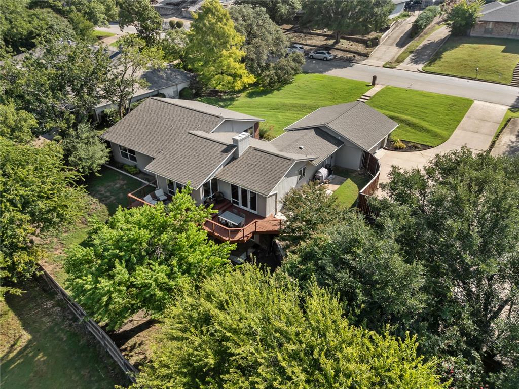 Multiple Offers Received-Highest and Best Sunday, 9-7 by 5pm *** Seller is offering a $10,000 concession to assist with an interest rate buy-down or to apply toward buyer’s closing costs—making this home an even greater opportunity!

Welcome to 16 Bounty Road W in Benbrook, TX – a striking mid-century residence offering timeless design and modern livability. With 4 bedrooms, 3.5 baths, and 2,835 sq. ft., this home blends character, space, and function in one of Southwest Fort Worth-Benbrook’s most desirable neighborhoods.

Inside, you’ll find open living areas filled with natural light, warm architectural details, and a flowing layout designed for both relaxation and entertaining. The spacious kitchen and dining areas connect seamlessly to the living room, making gatherings effortless.

The primary suite is a private retreat with generous closet space and a spa-inspired bath. Three additional bedrooms provide flexibility for family, guests, or a home office, ensuring everyone has room to live and work comfortably.

This property is located in a small, private pocket of Fort Worth, within Fort Worth ISD schools and served by the Benbrook Water District. The neighborhood is monitored by 24-hour security cameras, offering residents an extra layer of peace of mind.

Step outside to a full-length deck spanning the back of the home, where you can enjoy peaceful mornings, sunset dinners, or host friends overlooking the backyard.

With its unique mid-century style, thoughtful updates, and ideal location, 16 Bounty Road W is more than a home—it’s a lifestyle ready to welcome its next chapter.