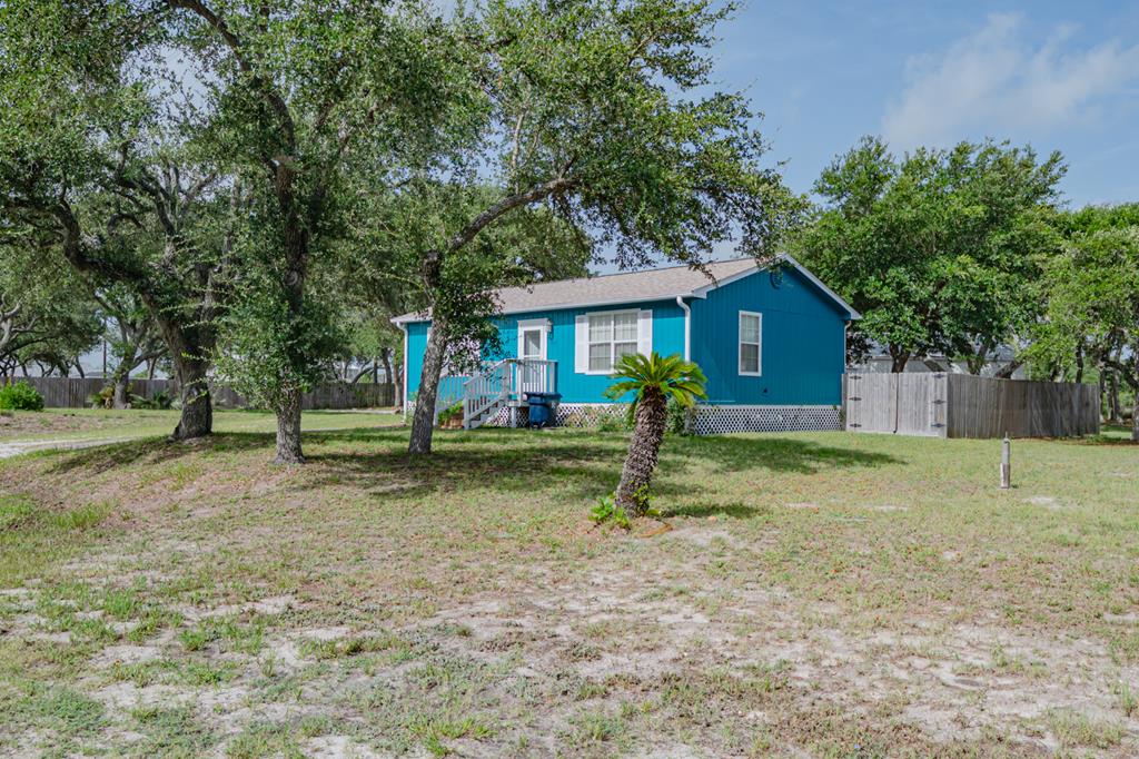 Coastal Charm in the Heart of Fulton! Welcome to 809 N Tenth Street—a delightful 2-bedroom, 2-bath home located in the vibrant and historic coastal town of Fulton, TX. Just a short drive to the Fulton Fishing Pier, waterfront restaurants, and unique local shops, this property is perfectly positioned for both relaxation and adventure. Whether you're seeking your own vacation retreat or a potential income-producing Airbnb, this home offers flexibility and charm.  The home features an open layout with coastal-inspired finishes, a freshly painted exterior, and a recently installed A/C unit for year-round comfort. Step outside to a spacious backyard with two storage buildings—perfect for storing beach gear, fishing tackle, or other essentials.  Situated in the highly sought-after Rockport-Fulton area, you'll enjoy world-class fishing, birding, art galleries, coastal festivals, and a laid-back lifestyle that makes every day feel like a vacation. Whether you're entertaining guests or unwinding after a day on the bay, this home is the perfect coastal escape.  Don't miss your chance to own a piece of the Texas coast!