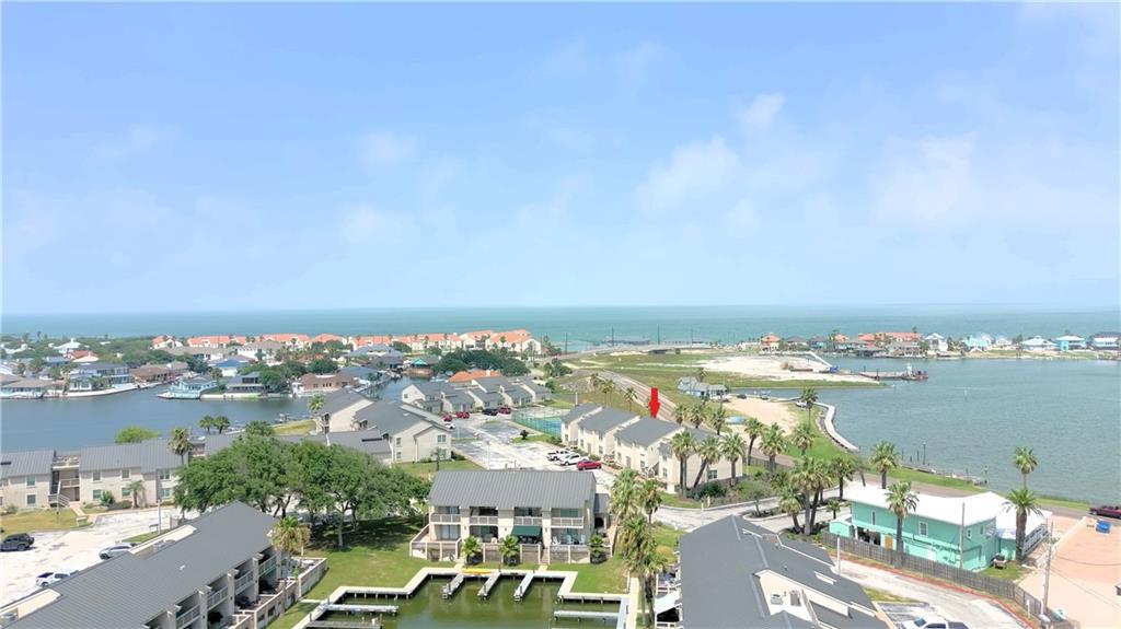 Experience coastal living in this stunning one-level condo. Featuring two spacious bedrooms each with its own private bathroom, this home offers comfort and privacy for all residents. The living room is beautifully enhanced with built-in cabinets, providing ample storage space. Enjoy serene views of Little Bay right out the windows in the living room and primary bedroom. Two porches with access to grass for all your entertaining needs. This home comes fully furnished, decorated in coastal charm. Additional amenities include your own private boat slip, access to two community pools and a tennis court. This condo perfectly blends convenience with access to Fulton Beach Road where you can golf cart along the water to downtown entertainment.