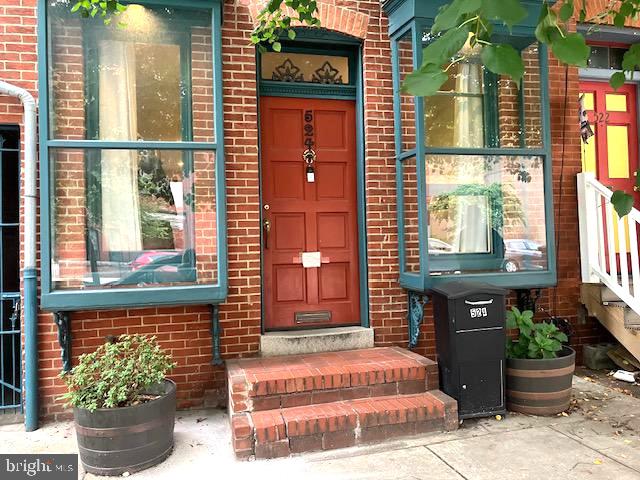 Nestled in the heart of the historic Fells Point district, this exquisite interior row townhouse, built in 1870, seamlessly blends timeless elegance with modern comforts. Spanning 1,975 square feet, the open floor plan invites you to experience a warm and inviting atmosphere, perfect for both relaxation and entertaining. Step inside to discover stunning wood floors that exude charm and sophistication. The kitchen, is equipped with high-end appliances, including a gas oven/range, refrigerator, and disposal, making culinary adventures a delight. Natural light pours in through double-pane casement windows, enhancing the home's airy feel. The property boasts a quaint patio, offering a peaceful retreat right outside your door. Enjoy the vibrant lifestyle of Fells Point, with its rich history, eclectic shops, and waterfront views just moments away. On-street parking ensures convenience for you and your guests. Whole Foods, Coppermine Gym, several coffee shops, restaurants and bars within a few blocks.  Available for lease starting October 1, 2026, this residence offers flexible leasing options ranging from 12 to 24 months, allowing you to settle into this exclusive lifestyle at your own pace. Experience the perfect blend of historic charm and modern luxury in a home that truly feels like a sanctuary. Embrace the opportunity to make this remarkable property your own.