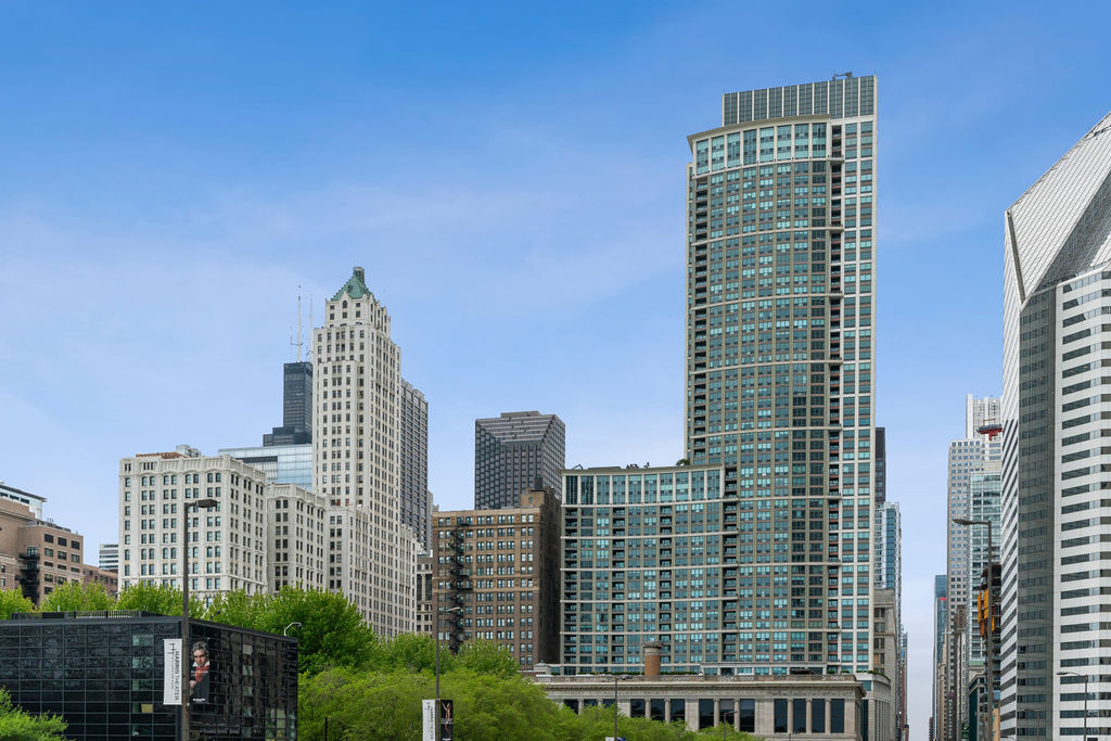 COMPLETELY REMODELED luxurious 2 bed/2 bath residence with UNOBSTRUCTED panoramic lake, The Bean, Millennium Park and city views from EVERY SINGLE ROOM in the prestigious The Heritage at Millennium Park building! Not only is this home in the heart of downtown but it also features oversized windows, a desired open kitchen/living room layout, split floor plan, rich wide plank hardwood floors throughout and a PRIVATE balcony overlooking the same BREATHTAKING views!!! Modern chef's kitchen boasts stainless steel appliances, white cabinetry, quartz countertops with full backsplash, breakfast bar and tons of storage. ENORMOUS primary suite with A MASSIVE professionally organized custom walk-in closet, completely remodeled luxurious spa-like primary bathroom complete with dual sinks, quartz counters, a large soaking tub, separate walk-in shower, heated floors and exquisite finishes. Oversized second bedroom with the same stunning views and fully renovated bathroom right next door. Full-amenity building with 24-hour door staff, on-site management, party room, conference room, sauna, indoor pool, fitness center, outdoor terraces, dog run, storage, Pedway access and more! Just steps to grocery stores, Michigan Ave, the lakefront, RiverWalk, museums, shopping, the best restaurants and nightlife Chicago has to offer, coffee shops, parks and so much more. Close proximity to Lakeshore Drive, highways and public transportation. Two deeded garage parking spaces available for $50K each.