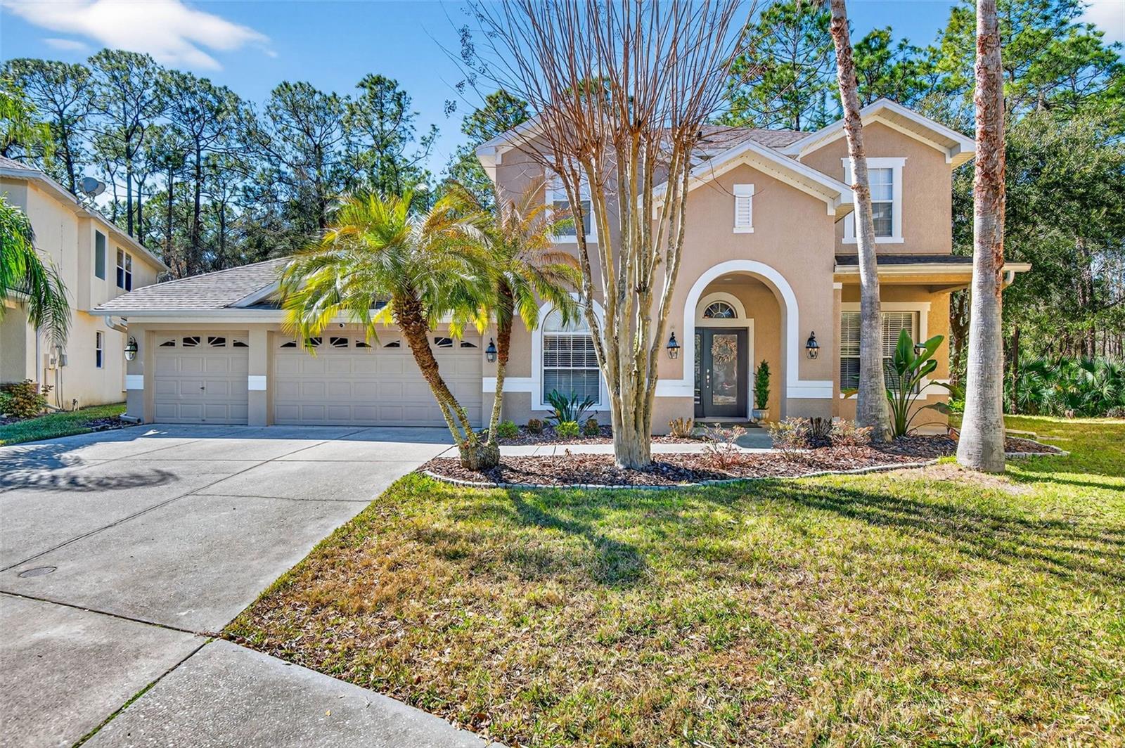 Under contract-accepting backup offers. Fall in love with the Tampa Palms lifestyle in Buckingham, a gated neighborhood known for its pride of ownership and welcoming atmosphere. Peacefully situated on a quiet cul-de-sac with a beautiful conservation view, this warm and welcoming 4BR/3.5BA home offers 3,070 SF and a thoughtful layout that flows beautifully—bright, open, and made for everyday living and entertaining. Enjoy 10’ ceilings throughout the main level, an open kitchen overlooking the spacious family room with an airy, light-filled feel and conservation views. The main-level owner’s suite is a true retreat, featuring abundant natural light and a gorgeous view of the pool and conservation, plus a spacious, sun-filled bath.Step outside to your own retreat, enhanced by a serene conservation setting: a new, resort-style saltwater pool + spa, both screened and heated, complete with a child safety fence and a covered lanai area for relaxing, dining, and making memories year-round—plus a convenient pool half bath. Inside, you’ll find wood cabinetry, granite counters, stainless appliances, and a gas range, along with major updates including a 2022 roof and two HVAC systems (2020 & 2024). Ideally located near I-75, USF, Moffitt, shopping, dining, and miles of trails at Flatwoods Conservation Park.This is a special home — schedule your private showing and discover the comfort, privacy, and lifestyle that will help you create beautiful everyday moments and lasting memories