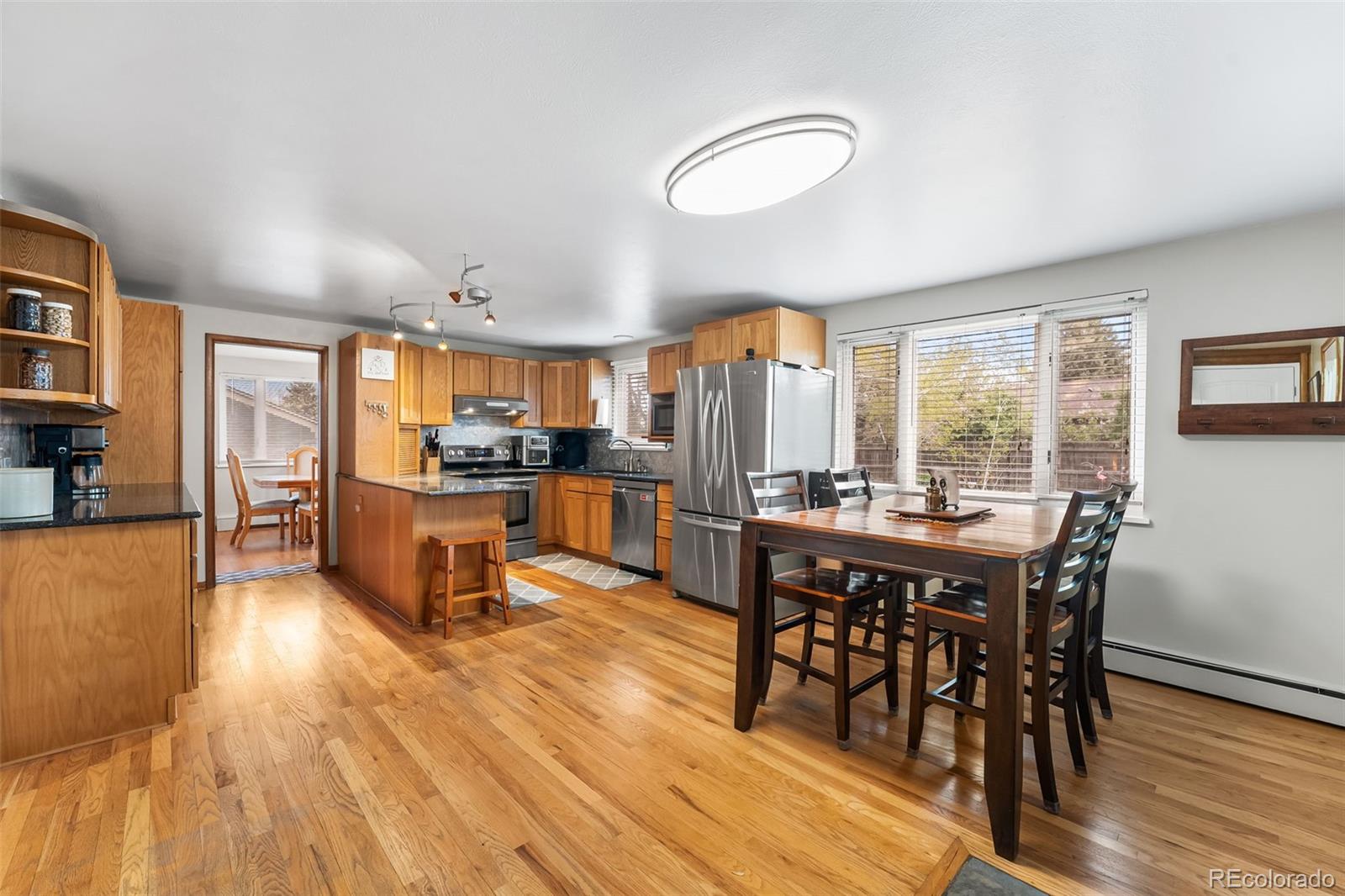 Don't Miss this Beautiful, BRICK Home on a Large, Lakewood Lot, Surrounded By Mature Landscaping, Boasting 4 Bedrooms and 3.5 Baths, with Fully Finished Basement!  Discover Hardwood Floors Throughout Home and an Updated Eat-in Kitchen with Ample Counter and Cabinet Space and Granite Countertops, All Appliances Included. Cozy Basement Includes Family Room with a 2nd Fireplace, Full Bathroom, and 2 Additional Bonus Rooms for Nonconforming Bedrooms, Office or Exercise Spaces. Upstairs Reveals  Another Large, Bright Bonus Room, a Primary Suite with 3/4 Bath, a Full Bath, and 3 Additional Bedrooms. A Private Backyard and Covered Patio is Perfect for Relaxation and Testing Your Green Thumb with the Existing Greenhouse and Space for Endless Gardens.  Note the Coveted West Facing, Oversized Driveway, and in Addition to the 2 Car Attached Garage, the Additional Detached, Oversized Garage Ideal for All Your Toys, Hobbies and/or Workspace.  This is a Rare Find in the Heart of Lakewood!