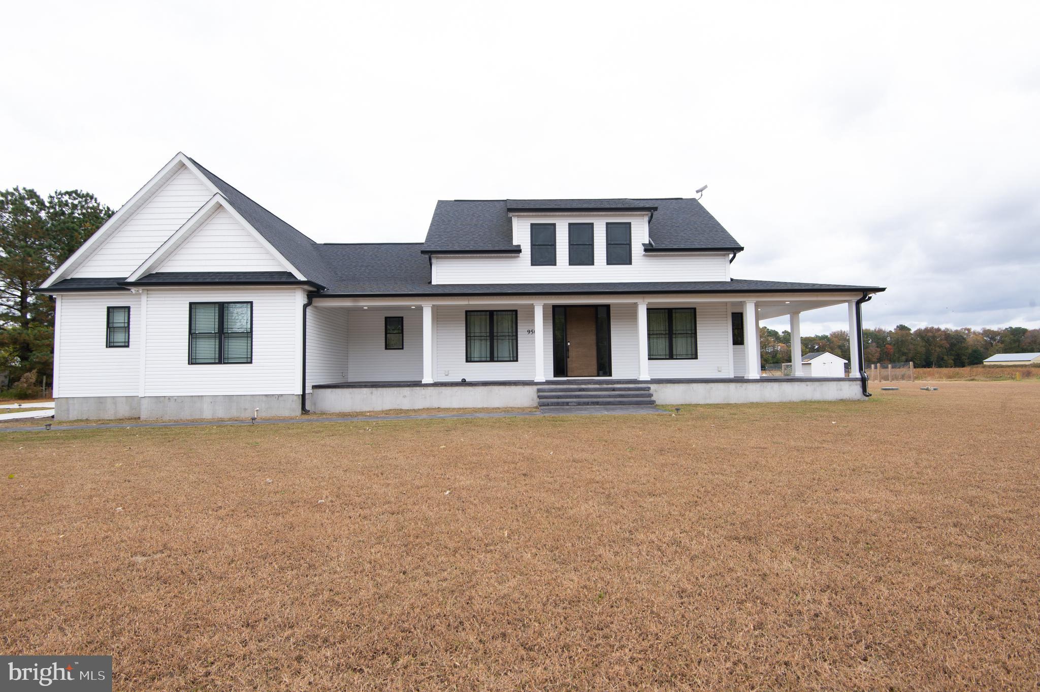 Welcome to a truly one-of-a-kind custom-built property that blends timeless design with everyday modern comfort. Situated on 1.72 acres in a peaceful setting with over 3,300 sq ft of living space, every detail has been considered to offer a lifestyle of comfort, quality, and elegance. Finished at the end of 2023 and thoughtfully enhanced throughout 2024 with exterior upgrades, this home is absolutely move-in ready and waiting for its next owners. The seller is motivated, so now is your chance to own this incredible property before it’s gone!As you arrive, the concrete driveway and stunning wrap-around stamped concrete porch set the tone for the quality you’ll find inside. Step through the front door into a light-filled living room featuring soaring vaulted ceilings, LVP flooring, a striking floor-to-ceiling shiplap fireplace, and sliding glass doors that open to your backyard retreat. The dining area flows effortlessly into the gourmet kitchen, where quartz countertops, a spacious island with built-in microwave, custom tile backsplash, top of the line appliances, and a modern range hood create the perfect space for everyday meals or entertaining. A spacious walk-in pantry with built-in shelving adds function and charm, The primary suite is a true retreat. The spacious primary bedroom is complete with vaulted ceilings and a second shiplap floor to ceiling electric fireplace. The spa-like primary bathroom features tile flooring, a freestanding soaking tub, oversized walk-in tile shower, and dual quartz countertop vanities with LED light mirrors above. The walk-in closet with custom built-ins connects directly to the bathroom for added ease. Two additional bedrooms each with walk-in closets share a beautifully designed Jack-and-Jill bath with a double sink quartz countertop vanity, tile flooring, and a tile shower. A cozy study nook with shiplap accent wall and floating desk provides the perfect workspace or reading area.Upstairs, a spacious bonus room above the garage provides endless flexibility — perfect for guests, a home office, or a media room. Complete with its own full bath, walk-in closet, and ductless mini-split system for comfort. Outside, the property truly shines. Enjoy the covered outdoor entertainment area complete with recessed lighting, electric hookups, and a custom multi-function brick grill with oven and stovetop. The stamped concrete patio with a custom stone firepit and custom stone built-in bench seating area offers the perfect spot to unwind under the stars. You’ll also appreciate the brand-new custom shed and convenient half bath off the back porch for outdoor entertaining.