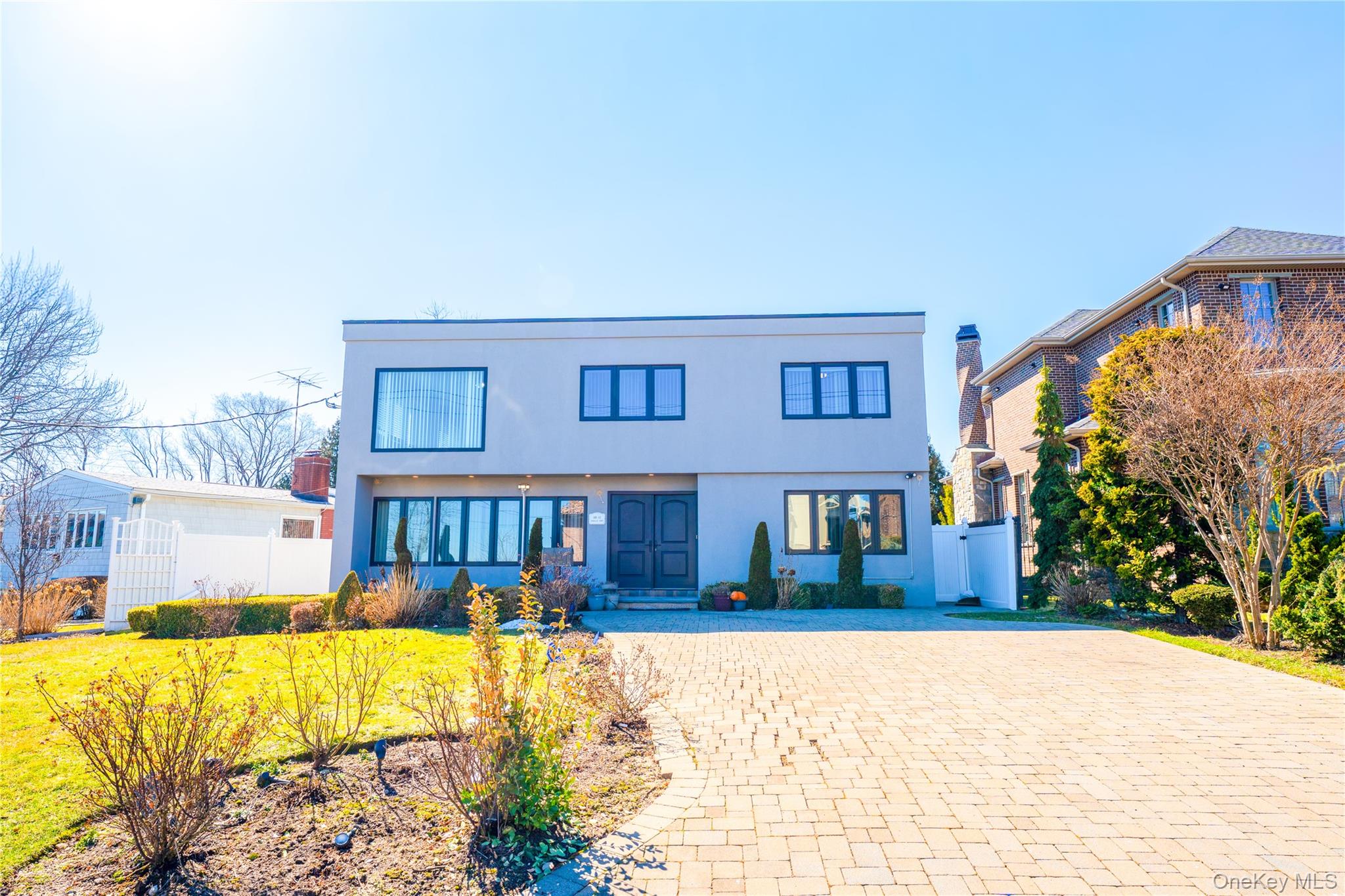 Amazing water-view Mediterranean-style home situated on a 7,000 SF lot, featuring 5 bedrooms and 4.5 bathrooms. The home has been fully updated with a brand-new kitchen and modernized bathrooms. Located in the prestigious Whitestone Woods community with access to a private beach, this property offers exceptional privacy on a quiet street. The beautifully landscaped yard features a heated in-ground pool, perfect for relaxation and entertaining. A must-see!