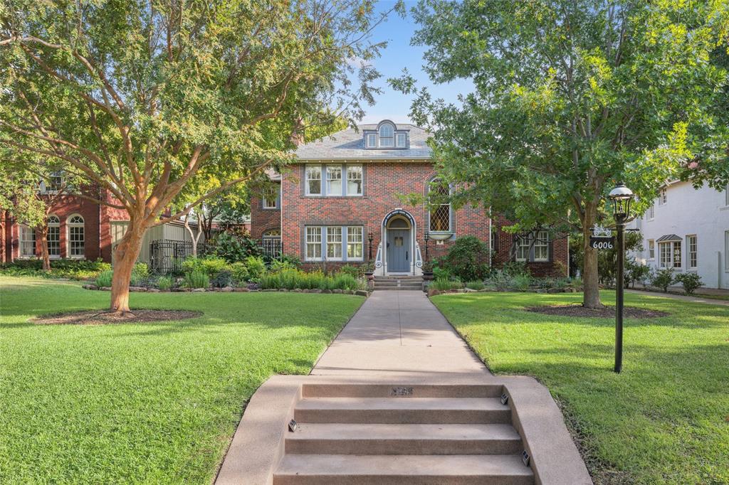 Nestled on one of Dallas’s most prestigious, tree-lined streets, this stunning 1924 architectural gem embodies timeless elegance and authentic architecture. The home sits on historic Swiss Ave and showcases an exceptional blend of preserved original details and modern updates, offering a one-of-a-kind living experience. Step inside to discover exquisite architectural features including a leaded-glass diamond pane window, tile floors, arched doorways & rich hardwood flooring. The numerous french doors warm the space and offer a light and airy ambiance. The sun-filled space also includes picture frame molding, plantation shutters and is complemented by two charming fireplaces — one in the spacious living room and another in the serene master bedroom. The office featuring floor-to-ceiling windows, & opens to an inviting side patio, creating a seamless connection between indoors and out. Enjoy elegant entertaining in the formal dining room, or start your mornings in the cozy breakfast nook. The gourmet kitchen features a center island, granite countertops, and stainless-steel appliances, ideal for both casual family meals and gatherings with friends. Upstairs, you’ll find 4 well-appointed bedrooms plus a sunroom perfect for relaxation or creativity. Set on an impressive 80x253 lot, the property boasts a beautifully landscaped yard with an English-inspired perennial garden, a covered patio perfect for al fresco dining, and a canopy of mature trees. A 4-car garage with both alley and street access, electric gates, and generous space for a future pool enhance the property’s versatility. Additional amenities include quarters above the garage and ample storage in both the basement and attic. Walk to local shops, dining, and Lakewood CC, with Downtown Dallas & airports minutes away.