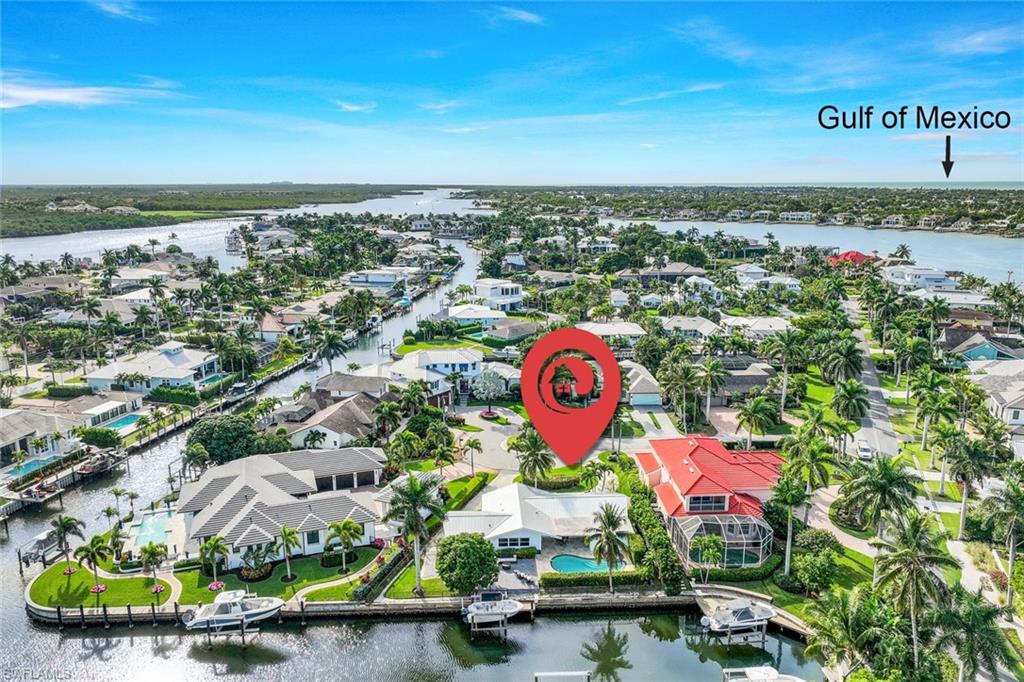 Experience the pinnacle of waterfront luxury living in this beautifully remodeled Royal Harbor residence, ideally positioned on a highly sought after, low traffic cul-de-sac just off prestigious Kingfish Road. Offering an exceptional blend of elegance, comfort, and coastal sophistication, this move-in and rental ready home features 3 spacious bedrooms plus a private den and 2 impeccably updated bathrooms.Designed with both style and peace of mind in mind, the home showcases PGT hurricane impact windows, doors, and sliders throughout. The stunning chef’s kitchen is a true centerpiece, featuring expansive quartz countertops, custom cabinetry, premium stainless steel appliances, and abundant prep and entertaining space. The luxurious primary suite offers a serene retreat complete with a generous walk-in closet and a spa inspired bathroom with refined designer finishes.The expansive open-concept living area is flooded with natural light and crafted for effortless entertaining, seamlessly blending indoor and outdoor living through oversized sliding glass doors and a convenient pass through kitchen window. Step outside to your private tropical oasis where a fenced lanai, sparkling pool and spa, and lush professional landscaping create a true resort style atmosphere.Boating enthusiasts will appreciate the private dock and boat lift with direct Gulf access and no bridges, allowing quick and effortless navigation to the Gulf of Mexico and the pristine beaches of Keewaydin Island. Located just minutes from the world class dining, luxury shopping, and vibrant nightlife of 5th Avenue South, Downtown Naples, Naples Pier, and Naples Airport, this exceptional property embodies the very best of upscale Naples waterfront living. This is a rare opportunity to own a luxurious slice of paradise in one of Naples most prestigious waterfront communities, make this exceptional home yours today!