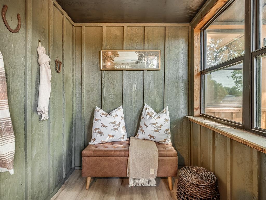 New Interiors coming next week! Welcome home to your fully remodeled, luxury cabin-style retreat nestled among the trees in Northeast Norman. This one-of-a-kind property perfectly blends charm, comfort, and modern updates—all within the highly sought-after Robin Hill School District. Set on two serene acres, this home offers the peace and quiet of country living with picturesque sunrise and sunset views through the trees. Every window frames a beautiful scene of nature, creating a sense of calm and connection to the outdoors. Inside, you’ll find brand new floors, fresh interior and exterior paint and stain, new fixtures, and no detail left untouched. The primary suite features a fully remodeled bathroom - custom ceramic tiled shower complete with a ornate extra tall rainfall shower fixture. The stunning attached sunroom is bathed in natural light—the perfect spot for morning coffee or evening relaxation with almost panoramic views. Enjoy cozy nights entertaining & dining in front of the gorgeous wood-burning fireplace, you’ll love hosting holiday gatherings in this stately space. Just off the dining room is the optional third bedroom, study, playroom, or flex space - you’ll love the utility & versatility the French doors allow this room to have. Step outside to the back yard unwind by the fire pit under the trees or under the covered back patio surrounded by nature. The detached two-car garage includes a wired-in garden space ideal for chickens, raised bed gardening, or your next outdoor project, making this home perfect for a hobby farm or peaceful homestead. With a brand new water heater, updated bathrooms , and countless thoughtful touches throughout, this home tells a story of care, warmth, and craftsmanship. If you’ve been dreaming of a cozy cabin retreat that balances rustic charm and modern luxury—this is the one.