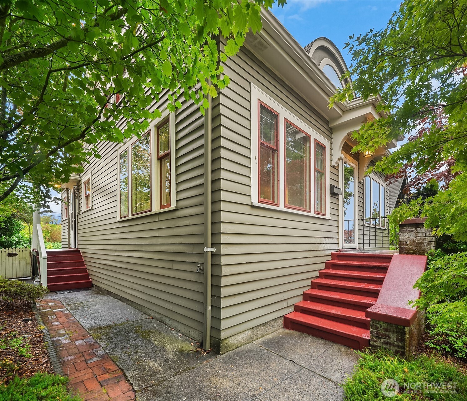 Tucked into the heart of Queen Anne, this quaint bungalow feels like home the moment you arrive—wrapped in old-world charm and filled with warmth, character, and a calm sense of comfort. Step inside to a spacious living room anchored by a cozy wood-burning fireplace, opening naturally to an inviting dining area. The functional kitchen includes a charming eating nook—perfect for slow mornings and easy evenings. With 3 bedrooms and 2 bathrooms, and the primary suite upstairs, you get both privacy and everyday convenience. Outside, a beautiful garden awaits—somewhere to exhale, unwind, and enjoy beauty that never feels rushed. Thanks to thoughtful updates throughout, you’ll enjoy the best of both worlds: timeless charm with the peace of mind that comes from modern improvements. And with Queen Anne right at your doorstep—restaurants, Trader Joe’s, and daily conveniences just blocks away, plus quick access toward downtown—this isn’t just a place to live. It’s a place to settle in and truly enjoy life.