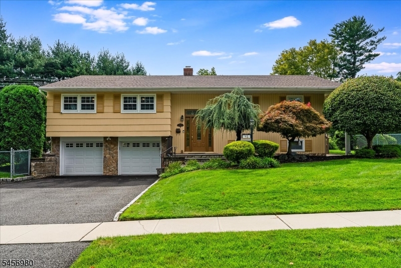 Meticulously maintained and beautifully updated, this spacious four bedroom, three full bath home is set on nearly half an acre in the highly desirable Washington School?s Blue Ribbon School District on the North side of town. Offering a flexible floor plan, the home also features a bonus home office. The gorgeous updated kitchen is appointed with custom cabinetry, stainless steel appliances and beautiful quartzite countertops and flows seamlessly into the dining area. Just off the dining room is a wonderful three season room (playroom) overlooking the expansive property, an ideal space for relaxing or entertaining. The inviting living room features vaulted ceilings, creating a bright and open feel, while the three full updated bathrooms add to the home?s move-in-ready appeal. Additional highlights include an irrigation system, a solar powdered security system, a whole house generator, gleaming hardwood floors & a spacious two car attached garage. The beautifully landscaped, expansive and fully fenced in property offers exceptional space and room to relax & entertain on the large deck or lower patio. Thoughtfully maintained inside and out, this special home combines space, comfort and modern updates in one of the town?s most sought-after school district & locations!