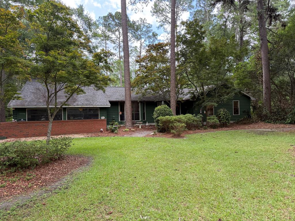 This charming three-bedroom, two-bath residence offers the perfect blend of comfort and tranquility, nestled on a spacious 1.3-acre lot in a country setting. Enjoy the convenience of a bonus living room, ideal for family gatherings or cozy nights in, and relax on the screened-in back porch overlooking your expansive yard. With a two-car garage, you'll have plenty of space for vehicles and storage. Experience peaceful living while still being close to local amenities. Offering a 1 year Home warranty through America's Preferred Home Warranty paid for by the seller. 3D Walk though https://my.matterport.com/show/?m=Ziy2BoyaaxW