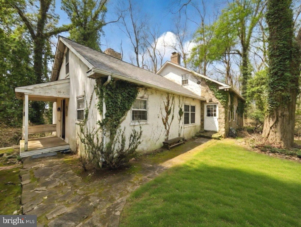 Nestled in the heart of sought-after Birchrunville in Chester Springs, this exceptional property offers a rare blend of timeless charm, serene countryside living, and endless potential. Set on two parcels totaling 18 acres (7.5 acres and 10.6 acres), the property provides both a private homesite and a picturesque pasture just across the street—perfect for equestrian use or simply enjoying the beauty of open land.  The home was thoughtfully designed to capture the character of an older farmhouse, featuring warm, inviting spaces and classic architectural details throughout. The main level offers a spacious kitchen with a large pantry and a pass-through to the eating area, a formal dining room, and a cozy living room highlighted by a stunning stone fireplace. An additional living room with its own fireplace and access to the porch creates the perfect setting for relaxing or entertaining. A private office or library and a convenient half bath complete the first floor.Upstairs, the second floor offers a main bedroom with a full bath, along with two additional bedrooms and another full bath. There is also an unfinished space that presents a great opportunity—perfectly suited for a future playroom, studio, or home office if finished.  Outside, the property continues to impress with a 4-stall barn and a 5-bay open garage, making it ideal for hobbyists, car enthusiasts, or those seeking a functional equestrian setup.  While the home maintains its original charm, it offers an incredible opportunity for updates and customization. With its expansive acreage, multiple parcels, and highly desirable location, this is a truly special offering with endless possibilities.