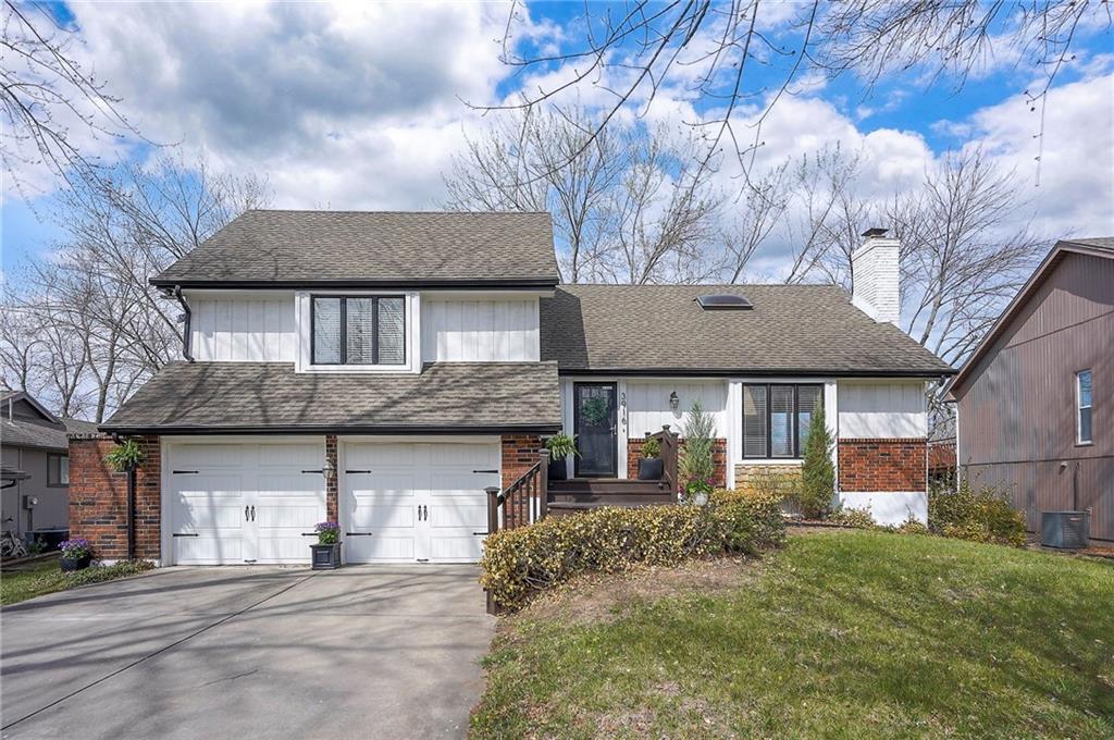 Waterfront home in beautiful Raintree Lake.   Centrally located on a quiet cul-de-sac just blocks from the clubhouse and pool.  Wonderful lake views throughout the home and from the spacious tree covered deck &... you can fish from your own backyard.  Light, bright and so inviting.  Fully updated with beautiful hardwood flooring on main floor and durable LVP in walk-out lower lever.   Freshly painted interior, customized ceilings, beautifully updated baths, new windows and patio doors, replaced garage doors, HVAC, added new composite siding and cedar shutters and much more.  A short distance to Walmart, grocery, pharmacy, dining and easy access to highways & the Costco currently under construction as well as expanded shopping and dining areas.  Lee's Summit Schools.   A great home and lake community to enjoy in every season.  Come see it today!