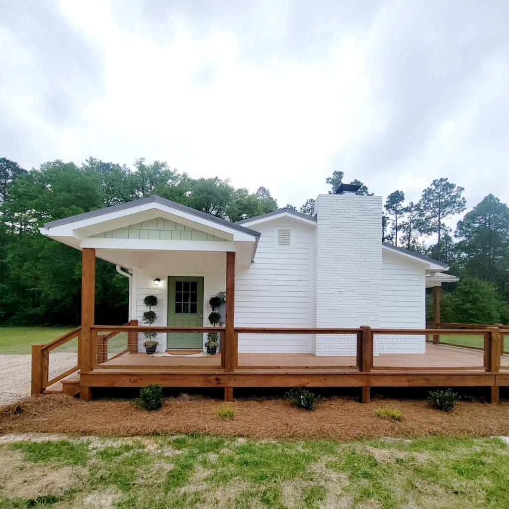 Charming 10-Acre Homestead with Two Beautiful Homes, Shop & Stocked Pond! Welcome to your own private retreat! Nestled on 10 peaceful acres, this fully remodeled property offers the perfect blend of modern comfort and country living. The main home features 4 bedrooms and 2 bathrooms, boasting spacious living areas, updated finishes, and plenty of natural light. Just steps away, the second home is a 3 bedroom, 2 bathroom residence with 1,152 sq. ft., ideal for extended family, guests, or potential rental income. Enjoy the outdoors with a large shop, perfect for hobbies, equipment, or storage, and a fully stocked pond that's ready for fishing and relaxing. The land offers endless possibilities—gardening, livestock, recreation, or simply soaking in the serene landscape. Two remodeled homes; 10 acres of beautiful land; Shop with ample space for projects or storage; Stocked pond for fishing & fun; Move-in ready and meticulously maintained; Don't miss this rare opportunity to own a multi-home property with space to live, work, and play. Tractor can also be purchased with the property! This one has it all! Schedule your private showing today—properties like this don't come along often.