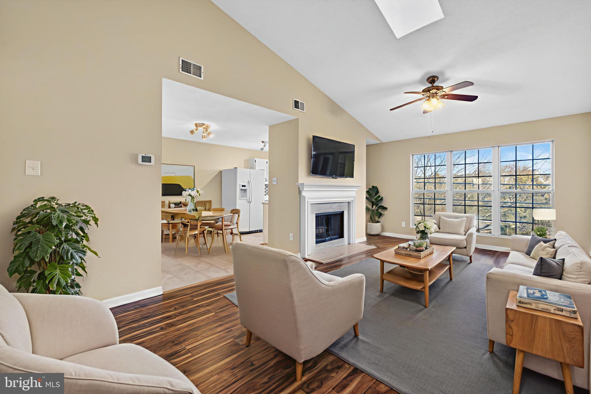 Welcome to Fox Chase at Exeter, where this beautifully maintained condo feels bright, fresh, and truly move-in ready with new paint throughout. Conveniently located with easy access to major roads, shopping centers, and the Leesburg Premium Outlets, this home offers both comfort and convenience in a highly desirable setting.The open-concept living area is filled with natural light from large windows and a skylight, highlighting stunning hardwood floors and a charming wood-burning fireplace that adds warmth and character. The spacious layout is perfect for both relaxing and entertaining.The kitchen is clean, bright, and functional, featuring classic white cabinetry, white appliances, and ample countertop space for meal preparation and storage. It flows seamlessly into the dining and living areas, creating an inviting atmosphere for everyday living.With three generously sized bedrooms and two full bathrooms, this home offers flexibility for families, guests, or a home office. The primary suite provides a peaceful retreat with ample closet space and a private bath.Additional highlights include well-maintained community grounds, ample parking, and proximity to parks, dining, and commuter routes. Enjoy the perfect blend of modern updates, timeless charm, and unbeatable location in the heart of Leesburg—an exceptional place to call home.