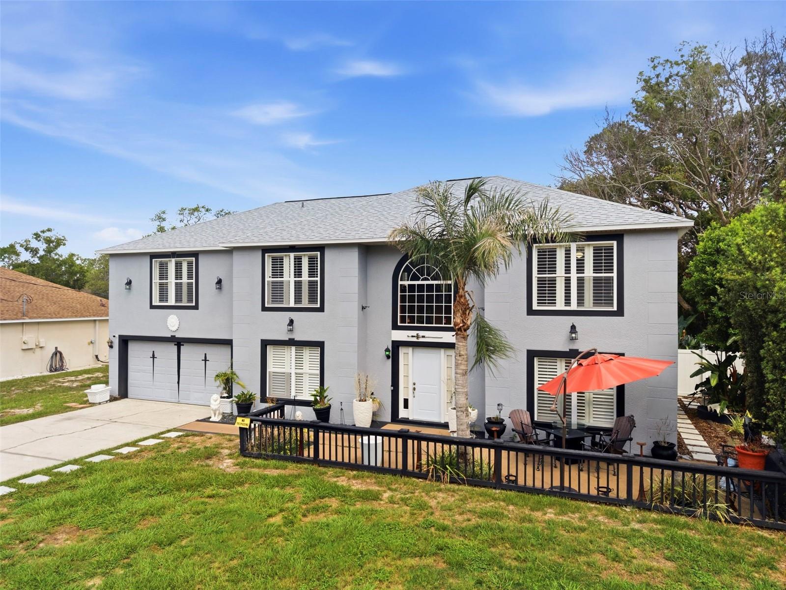 Welcome to this beautifully maintained, one-owner home offering nearly 3,000 square feet of thoughtfully designed living space in the heart of Spring Hill! Situated on an oversized nearly quarter-acre homesite with NO HOA and NO CDD fees, this impressive 5-bedroom, 2.5-bath residence combines space, style, and functionality for today's modern family. From the moment you arrive, you'll appreciate the BRAND-NEW ROOF, freshly painted interior and exterior, extra-long driveway, and spacious two-car garage. Inside, the home showcases numerous upgrades, including tile flooring throughout the main level, LUXURY VINYL PLANK flooring upstairs, elegant PLANTATION SHUTTERS, upgraded baseboards, decorative column trim, wood chair rail molding, and wainscoting that add timeless character and charm. The stunning OPDATED KITCHEN is a true centerpiece, featuring QUARTZ COUNTERTOPS, designer backsplash, top-of-the-line stainless steel appliances, ample cabinetry, and plenty of space for gathering and entertaining. Multiple living areas provide incredible flexibility, including a formal living room, dedicated dining room, spacious family room, and an upstairs loft ideal for a media room, playroom, home office, or secondary living space. Retreat to the oversized owner's suite, complete with a luxurious ensuite bath featuring a dual-sink vanity and two walk-in closets. Four additional bedrooms offer plenty of room for family, guests, or work-from-home needs. Step outside to enjoy the HUGE, FENCED BACKYARD - perfect for weekend barbecues, outdoor games, pets, and entertaining family and friends. Adding to the appeal, the home enjoys a peaceful CONSERVATION VIEW across the street, providing a beautiful natural backdrop and added privacy. Conveniently located near shopping, dining, parks, and HIGHLY RATED SCHOOLS this move-in-ready home offers the perfect blend of comfort, upgrades, and value. Don't miss this rare opportunity to own a METICULOUSLY CARED FOR home that truly has it all!