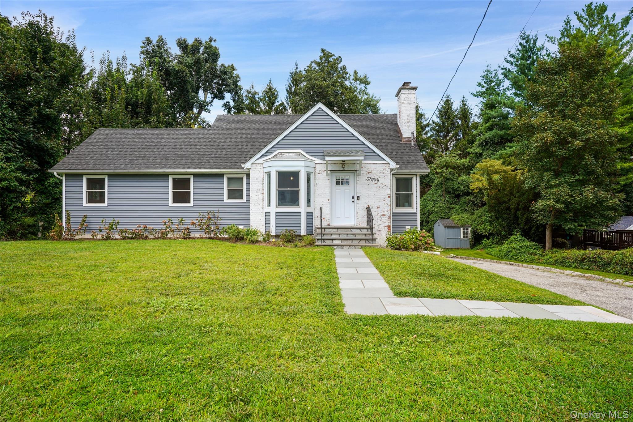 Welcome to this picture-perfect cape set on a quiet street, just minutes from major highways for an easy commute. Fully renovated in 2020, the home offers a fresh, modern feel while still keeping its classic charm. The main level features hardwood floors throughout and a bright, inviting living space. The beautifully updated eat-in kitchen stands out with quartz countertops, stainless steel appliances, and plenty of space for casual meals or entertaining. A first-floor primary suite adds convenience, complete with a walk-in closet and private bath. Upstairs you’ll find two generously sized bedrooms with hardwood floors and ample closet space.  The partially finished basement provides extra living options, including a mudroom and laundry area. Outside, enjoy your own backyard retreat with a stone patio and fire pit—perfect for summer nights or weekend gatherings. Close to to North White Plains Train Station and and Bronx River Pathway near Kensico Dam.  Move-in ready and designed for today’s lifestyle, this home is the ideal blend of comfort, style, and location.
