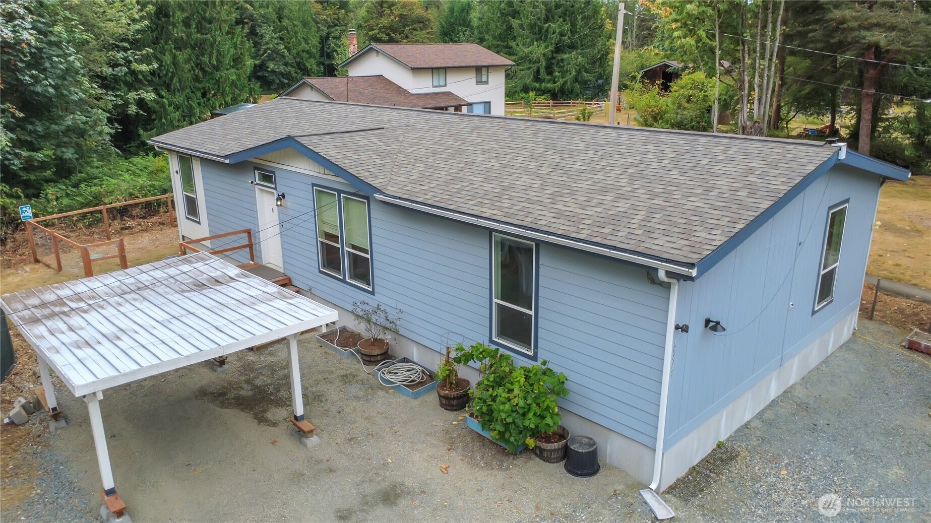 Don't miss this one! Like new 1,568 sqft double wide on huge shy acre lot! Built in 2018, this 3 bedroom 1.75 bath home features a wonderful living room off entrance with cozy fireplace, gourmet kitchen with stainless steel appliances, utility room with new LG washer + dryer, big master bedroom with walk in shower + double vanity and walk in closet, 2 additional spacious bedrooms with full bathroom off hallway. Enjoy the privacy this property offers. Gardening space, trails, plenty of parking space. Welcome home!