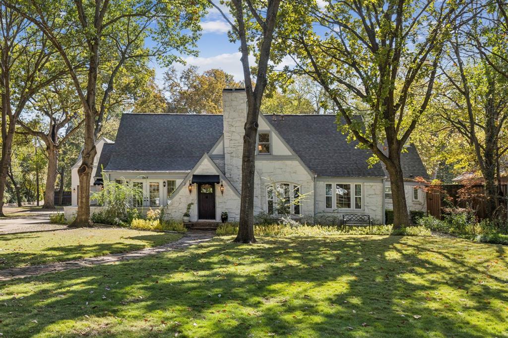 Welcome to 8184 Santa Clara Drive, a charming 1930 Tudor gem nestled in the heart of Forest Hills. This home is all about character and comfort, set on a tree-filled lot that gives you plenty of privacy and a lush, natural feel. With four spacious bedrooms, this house has been thoughtfully updated while keeping its vintage charm. The updated kitchen is a standout, complete with a built-in wine fridge, an expansive island and tons of natural light—it’s perfect for cooking up a feast for family and friends. The seller also added a handy mudroom off the side entrance and a full-size utility room with a drip dry area and a sink to make everyday living a breeze. Step out back, and you'll find your own private retreat with a sparkling pool and a 2023 built guest house by Tivoli Construction that is a must see! The guest quarters are around 1,000 square feet with a kitchenette, generous up and down stairs living space, and a full bath with a gorgeous spa-like shower  - this space is ideal for visitors or extra living space. The oversized garage has plenty of room for your cars and way more, plus there's still plenty of grassy area for playtime or relaxing! The home features a side entry for added convenience and is situated on a quiet street, offering a peaceful escape from the hustle and bustle.
