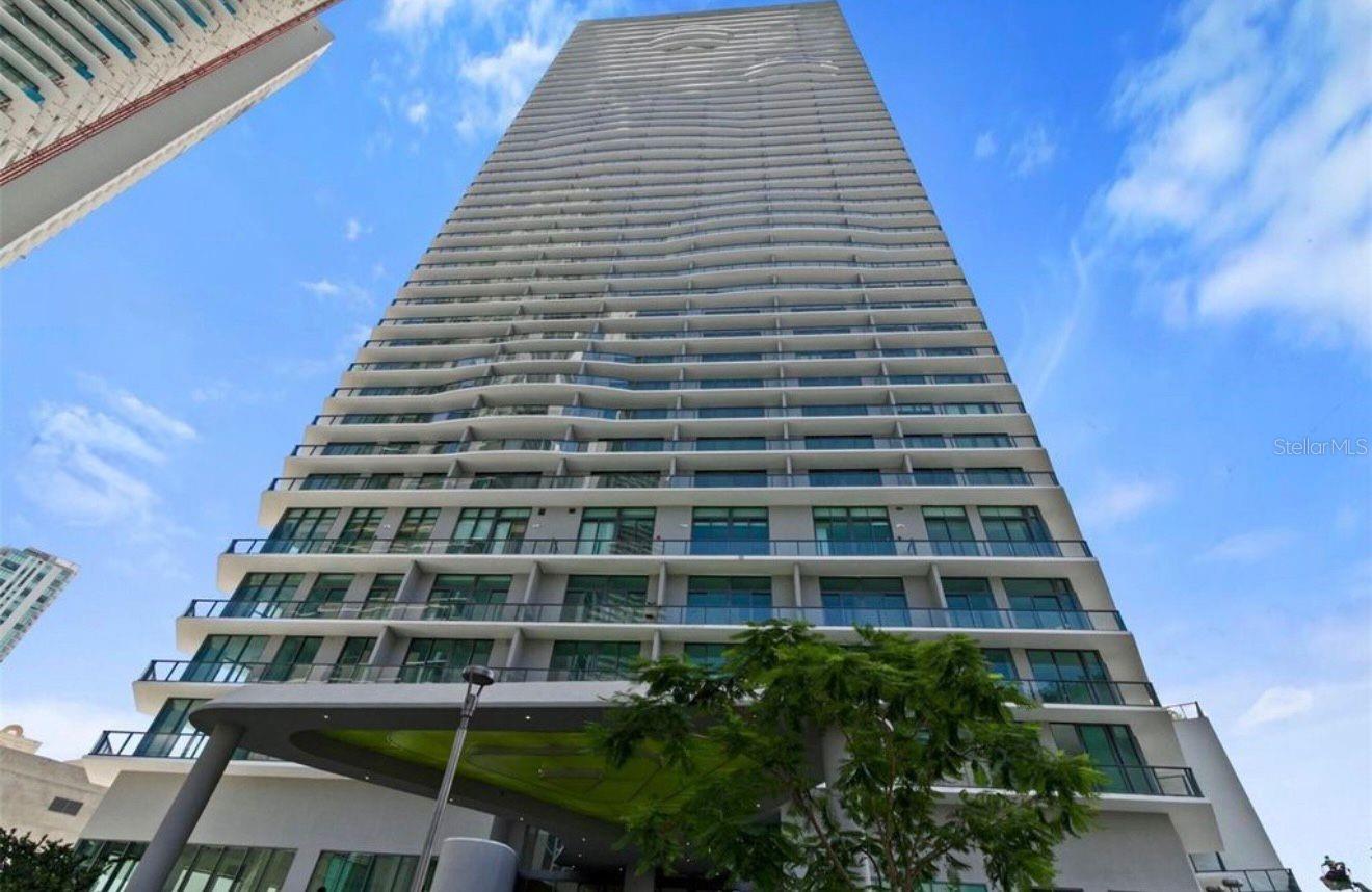 Stunning High-Floor Apartment in the Heart of MiamiDiscover an incredible opportunity to own a beautiful apartment on the 18th floor of a prestigious 48-story building in Miami. This residence offers the perfect blend of comfort, style, and convenience, with breathtaking panoramic city and water views and an elevated lifestyle.The apartment features two private balconies, providing spectacular views of the Miami skyline and the bay. Whether enjoying your morning coffee or relaxing at sunset, these spacious balconies offer the perfect setting to take in the stunning surroundings from every angle.The residence includes 2 spacious bedrooms, including a primary suite with a walk-in closet, and 2 full bathrooms. The open floor plan seamlessly connects the living room and dining room, creating a bright and airy space ideal for both everyday living and entertaining. Floor-to-ceiling sliding glass doors enhance natural light and provide direct access to the balconies, maximizing the incredible views.The kitchen is elegantly designed, showcasing solid wood cabinets, stone countertops, and all appliances included, combining functionality with modern appeal.This unit also offers an additional enclosed den with a door, creating a private and versatile space that can be used as a home office, guest room, or bonus room.Additional highlights include 1 assigned parking space and elevator access, ensuring comfort and practicality for daily life.The condominium itself offers exceptional amenities, including a large resort-style swimming pool, playground, fully equipped gym, game room, clubhouse, and more—designed to enhance your lifestyle and provide enjoyment for all ages.Ideally located near the main I-195, this property offers easy access to major routes, shopping, dining, and entertainment, while also being close to excellent schools.This is a perfect choice for buyers seeking a prime Miami location with outstanding amenities and a move-in-ready home. A must-see property that truly stands out.