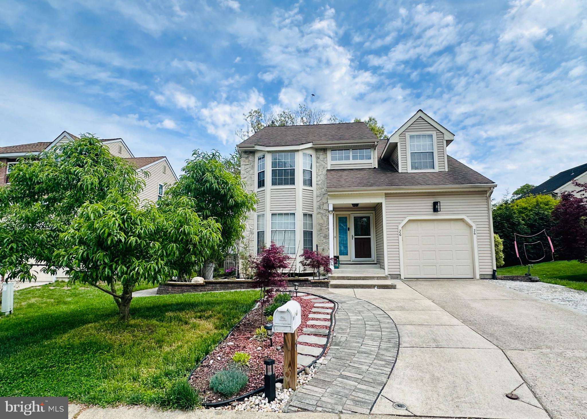 Welcome to this beautifully maintained home in highly desirable IVY RIDGE community. Lovely home with great curb appeal, spacious living areas, and thoughtful updates throughout. Step inside to a bright two-story foyer with hardwood stairs and warm-toned flooring that flows through the main living spaces. The kitchen features granite countertops, tile backsplash, recessed lighting, ample cabinetry, and a breakfast area overlooking the adjoining living space. Upstairs offers a spacious primary suite with bay windows, generous closet space, and a private bath with dual vanities, soaking tub, and separate glass shower. Additional bathrooms provide functional double-sink vanity space and neutral finishes. The finished basement offers flexible space for recreation area, home office, gym, or playroom. Outside, enjoy a back yard patio, mature landscaping, a paver walkway, and a welcoming covered front entry. A comfortable and versatile home with plenty of space for everyday living and entertaining.
