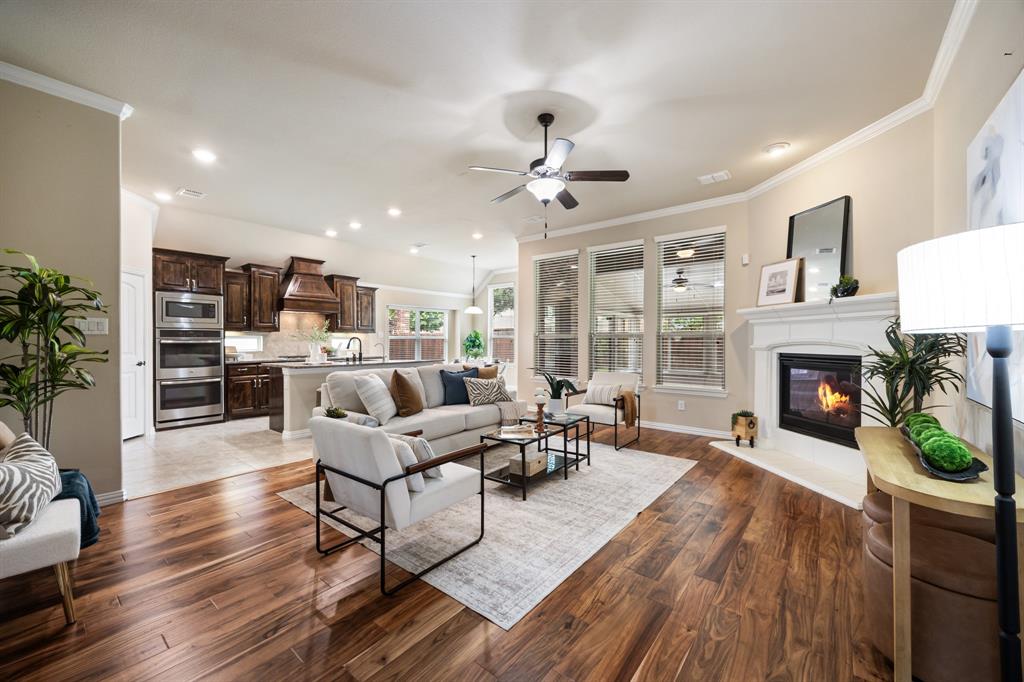 Beautifully maintained 1.5-story home in Frisco, offering the perfect blend of style, space, and location.  Featuring 4 bedrooms, 3 full baths, a private office, and a 3-car garage, this thoughtfully designed floorplan offers 3 bedrooms on the main level with a spacious upstairs suite—ideal as a guest retreat, game room, or secondary primary.  The open-concept living area is filled with natural light and anchored by a chef’s kitchen with stainless steel appliances, 5-burner gas cooktop, double ovens, under-cabinet lighting, and water filtration system—perfect for both everyday living and entertaining.  A standout feature is the enclosed patio, creating additional living space for year-round enjoyment—ideal for outdoor cooking, a sunroom, or home gym.  Enjoy the convenience of being just a short walk to the community pool and playground, adding to the home’s lifestyle appeal.  Ideally located near PGA Headquarters, University of North Texas, Universal Studios Theme Park Frisco, with easy access to the North Dallas Tollway and Hwy 380, this home offers exceptional connectivity to shopping, dining, and major employers.  Move-in ready, versatile, and ideally located!