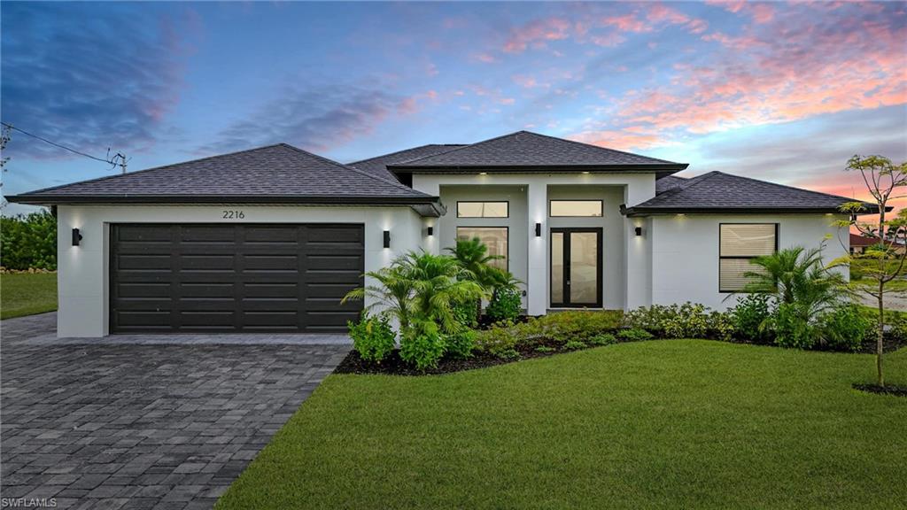 Welcome to your dream home on the Corsaire Canal! This brand-new 4 bedroom + Den, 3 full bathroom pool home is designed for both luxury and functionality. The versatile floor plan includes a private in-law suite with its own entry and full bath that also serves as the pool bath, creating the perfect setup for guests or multi-generational living. Inside, the open-concept layout features a gourmet kitchen with a huge waterfall-edge island, luxury appliances, and custom cabinetry, seamlessly flowing into the spacious living and dining areas overlooking the water. Elegant crack prevention tile flooring runs throughout the home, ensuring long term beauty and durability. Step outside to your private lanai and sparkling infinity salt water pool where you can relax and enjoy the tranquil canal views. Built with impact-resistant windows and doors, this home also offers a paver driveway with extended parking spaces, a two-car garage, and thoughtful designer finishes throughout. With energy-efficient construction and modern elegance in every detail, this home blends style, comfort, and the best of the Southwest Florida lifestyle. No HOA, No Flood Insurance, No Drama! All Assessments in and paid.