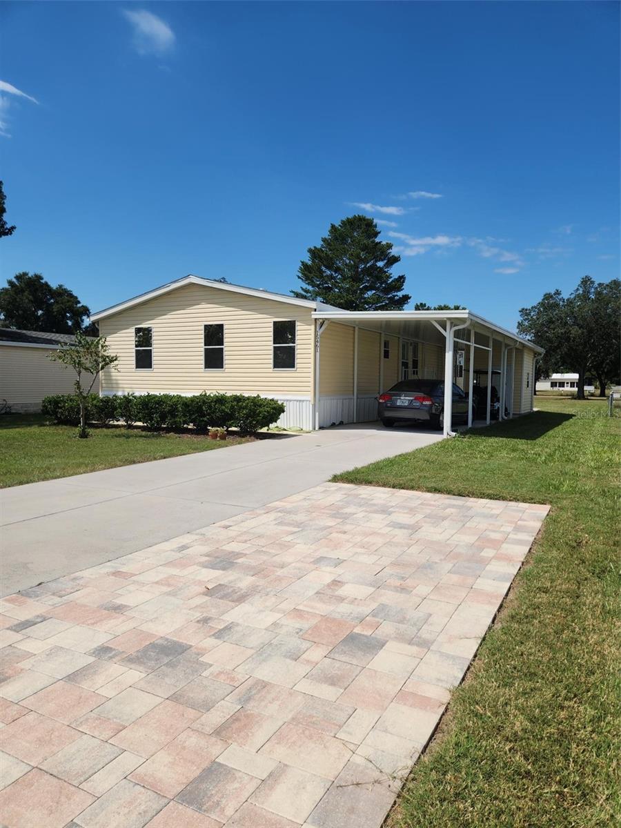 This lovely 3/2 custom built home has a rear deck across the back of the home so that you can enjoy the view of the second hole of the Golf Course and sunsets. Located in Brookridge Community, a gated 55+ deed restricted golf course community with many amenities and activities at the clubhouse included for only 55 dollars monthly. You own the land/no lot rent! Golf carts are allowed to be driven on the streets in the park for added fun and convenience. Golf memberships are optional/extra. The owners made some thoughtful decisions and upgrades to the home when new and recently including textured walls, 2 shower heads and extra cabinets in the primary bathroom, a shingle roof, upgraded sprinkler control, exterior motion spotlight, complete home electric surge protection, an extra open patio behind the shed, a paver parking pad, extra roof insulation and most of the windows have been tinted for extra energy efficiency. Brookridge Community is conveniently located close to the Suncoast Parkway for commuters, and near many local amenities including medical, shopping, banking and restaurants. There's optional social and golf memberships available within the community. The west central coast area has many parks, waterways and outdoor recreation of Florida's Nature Coast. This property is not located in a flood zone. Buyers should verify all information, including measurements, school zones and community details. Audio/video may be onsite.