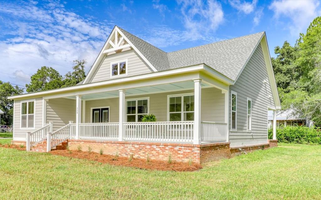 Brand-New 2026 Construction in the Heart of Boston, Georgia  Completed in early April 2026 and never lived in, this beautiful new home offers 3 bedrooms, 2 bathrooms, and 1,797 heated and cooled square feet on a quarter-acre lot. It combines low-maintenance modern construction with the charm of one of South Georgia's most welcoming small towns.  Inside, you'll find an open floor plan with 10-foot ceilings throughout and a vaulted living, kitchen, and dining area that creates a bright, spacious feel. Luxury vinyl plank flooring, crisp white trim, black hardware, and neutral finishes provide timeless style that's ready for your personal touch.  The kitchen features traditional white cabinetry, GE appliances, a farmhouse sink, pantry storage, and plenty of workspace for everyday living. The home is washer and dryer ready and includes attic access for additional storage.  The primary suite offers a spacious bathroom with a double vanity and oversized walk-in shower. Two additional bedrooms and a second full bath with a tub/shower combination provide comfortable accommodations for family or guests.  A 171-square-foot upstairs bonus room offers endless possibilities as a home office, playroom, hobby room, media room, extra storage, or potential fourth bedroom. Plumbing has already been roughed in for future expansion.  Outdoor living is one of this home's standout features. Enjoy the 35' x 10' covered front porch or entertain on the impressive 48' x 10' covered back porch with three ceiling fans—perfect for relaxing and enjoying South Georgia's beautiful weather.  Built with concrete siding, a 30-year architectural shingle roof, crawl space foundation, gravel driveway, and hydroseeded yard, this home was designed for lasting beauty and easy maintenance. A termite bond is already in place, inspections have been completed, and the home has received its Certificate of Occupancy.  Utilities include city water, city sewer, Georgia Power, all-electric systems, electric water heater, and Windstream internet availability.   Located in historic Boston, Georgia, you'll enjoy true small-town living within walking distance of downtown, churches, parks, a local caf, pizza restaurant, and The Silo 31626 among other sweet shops and retail.  Thomasville is only 12 miles away, Valdosta approximately 30 miles, and Tallahassee about 46 miles.  For weekend getaways, Florida's Forgotten Coast near Panacea is roughly 90 miles away, while St. Simons Island, Jekyll Island, and Jacksonville Beach are all within an easy drive.  No HOA. No flood zone.  Move right into brand-new construction without the wait and enjoy modern finishes, exceptional outdoor living, and the relaxed pace of charming South Georgia.