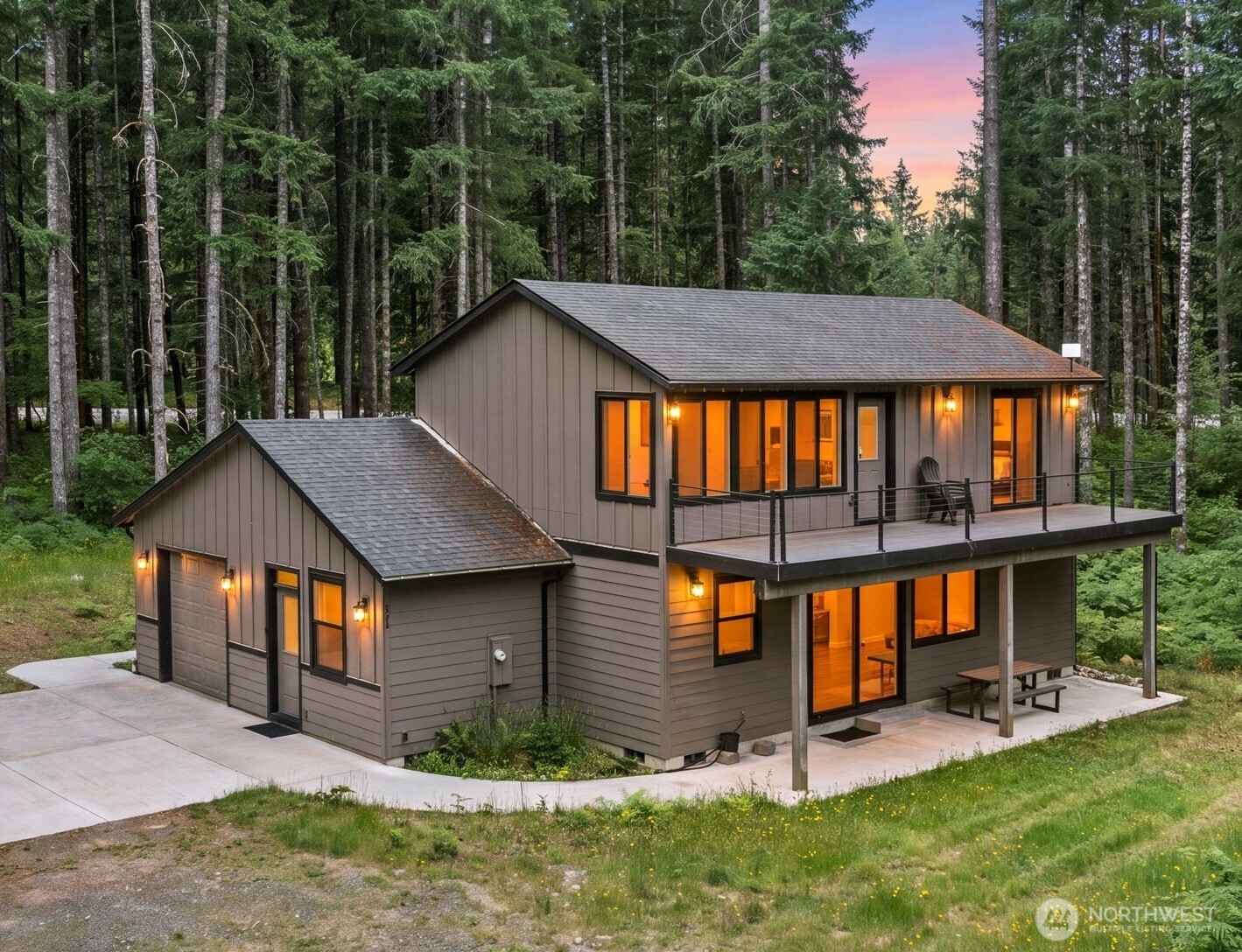 Escape to your own private mountain retreat on 5.35 wooded acres, where modern comfort meets Pacific Northwest beauty. In the desirable Riverdance community just about three minutes from Packwood, thoughtfully designed with quality craftsmanship and contemporary finishes, this custom home offers exceptional privacy and is easy walking distance to the 21.88 community commons acres on the Cowlitz River for swimming, fishing, and relaxing. The versatile floor plan features a great room, main-level guest bedroom, plus an additional finished flex room off the garage, perfect for guests, an office, or recreation space. A spacious entry provides convenient storage and staging for skis, bikes, fishing gear, and all your mountain adventures. Upstairs, two spacious en suite bedrooms each open to the second level deck with peaceful forest and river views. The primary suite also includes an oversized walk-in closet. Soaring ceilings, abundant natural light, quartz countertops, solid wood cabinetry, luxury vinyl plank flooring, on demand hot water and efficient forced air heating and A/C create a comfortable, low-maintenance retreat. Enjoy expansive decks, a covered hot tub, fire pit, woodshed, and room to explore your own forest. Minutes from White Pass Ski Area, Mount Rainier National Park, and Gifford Pinchot National Forest, this exceptional property is equally suited as a full-time residence, luxury vacation home, or investment opportunity.