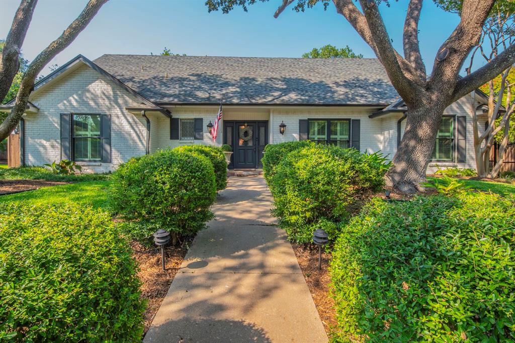 Located in Ridglea Country Club Estates & tucked away on a quiet cul-de-sac, this sophisticated home combines timeless style with modern updates and an inviting open layout. The spacious living area flows seamlessly into the cozy kitchen featuring freshly painted cabinets, new cook top, dual ovens, granite countertops, and a striking tile backsplash. The serene downstairs primary suite offers a spa-like bath with a freestanding jacuzzi tub, dual vanities, and custom-designed walk-in closets. A second bedroom and full bath are conveniently located on the main floor, while two additional bedrooms and a full bath upstairs provide plenty of space for family or guests.
The backyard is a true retreat with a diving pool, turfed yard and putting green, freshly stained fence, gated driveway, and a fully equipped outdoor kitchen with stainless gas grill, Green Egg, and mounted TV. Inside and out, the home has been carefully maintained and thoughtfully upgraded, including Pella windows across the front and Pella double backdoor unit, new hardwood flooring in the dining and guest rooms, a completely updated primary bath and custom closet system, and new turf and putting green. The laundry room was remodeled in 2018, all pool equipment was replaced in 2021, and two new HVAC units were installed in 2025. With lush landscaping, stylish finishes, and every modern convenience, this home is move-in ready and perfect for both everyday living and entertaining.