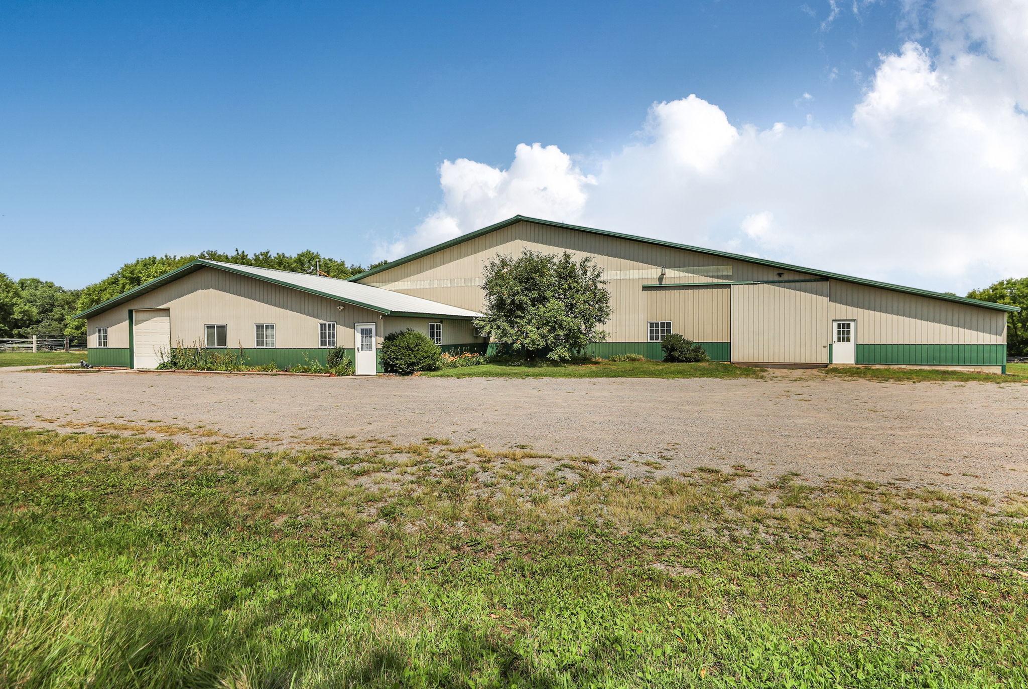 Formerly Fieldstone Farm, a fully operational equestrian center, this majestic property sits on 45 beautiful acres in highly desirable Saint Joseph and has been completely remodeled into a comfortable 2-bedroom, 2-bath home. The property features rolling woods, pastures, and scenic trails with direct access to the Wobegon bike and snowmobile trail. The approximately 20,000-square-foot building includes a radiant-heated indoor arena, offering endless possibilities. It is part of a joint annexation plan with the Township and City. The building was constructed in 2000, the metal roof was replaced in 2022, and the septic system is compliant. This remarkable property offers exceptional potential—schedule your showing today!