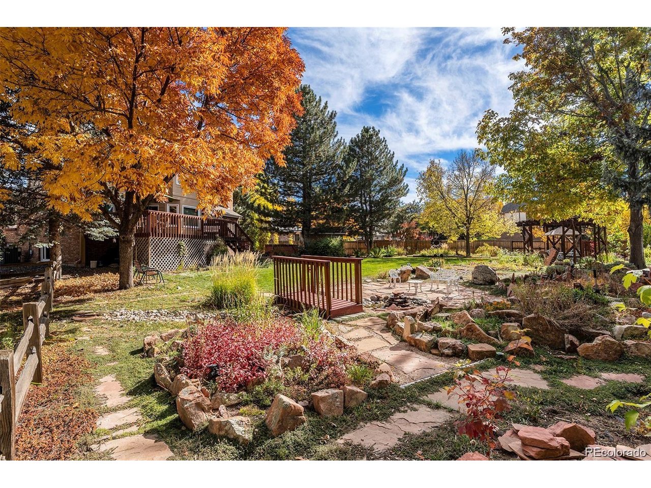 Absolutely stunning, this beautifully updated home is perfectly positioned on a meticulously maintained .3 acre premium lot in The Windings neighborhood of Westminster. Nestled on a quiet cul-de-sac, this park-like property offers exceptional privacy while providing easy access to world-class golf courses, miles of scenic walking and biking trails, recreation centers, shopping, dining, and more.Step inside to discover soaring ceilings, abundant natural light, and gorgeous new hardwood flooring that flows throughout the home, creating a warm, cohesive feel and enhancing every living space. Large windows perfectly frame the spectacular backyard views, seamlessly blending indoor and outdoor living.The beautifully appointed kitchen features quality cabinetry, stainless steel appliances, generous workspace, and convenient access to the expansive raised deck-ideal for entertaining or simply enjoying the peaceful surroundings.Upstairs, you'll find four spacious bedrooms, including a primary suite with a spa-inspired five-piece ensuite bath. Three additional bedrooms and a full bathroom provide ample space for family and guests.The finished basement is designed for entertaining and everyday enjoyment, featuring an entertainment area with custom built-in shelving, a large recreation space, a convenient laundry room, and abundant storage.Outside, the extraordinary backyard is truly one of a kind. Professionally landscaped with mature trees, lush lawn, a tranquil water feature, and a storage shed, this private outdoor oasis also includes an oversized deck and additional concrete patio perfect for relaxing or entertaining. A secondary gate provides convenient access from W. 103rd Avenue, adding flexibility and ease of use.Additional highlights include an oversized two-car attached garage and countless thoughtful updates throughout. Don't miss this rare opportunity in one of Westminster's most desirable neighborhoods.