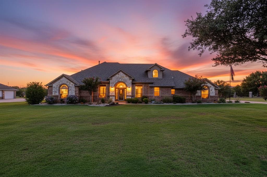 Welcome home to a perfect blend of tranquility and convenience. Nestled in the highly sought-after gated community of Harbour View Estates, this four-bedroom, brick & stone custom-built home sits on 1.22 acres overlooking the greenbelt & Little Dossier Creek, just across from Eagle Mountain Lake. Outdoor living is where this property really shines. The backyard is a serene oasis, featuring a stunning inground pool with a tanning ledge, tranquil water features, and a cool-to-the-touch salt rock deck, ideal for unwinding on warm days. Adding to the natural abundance, the property also offers three mature fruit trees, two pomegranate trees, and numerous native trees, providing a harvest for both you & local wildlife. Step inside the versatile open floor plan, ideal for both entertaining and comfortable family living. The recently remodeled kitchen features a Thermador five-burner gas cooktop, Zephyr vent hood, & generous island with a massive breakfast bar, all overlooking a beautiful brick fireplace with built-in shelving. The butler's pantry between the kitchen and formal dining room, is conveniently located down the hall from a spacious utility with sink and ample storage for a second refrigerator & freezer.  Relax and unwind in an expansive primary suite, where the luxurious ensuite bath has been fully updated with quartz countertops, dual sinks, & oversized shower featuring dual heads & handheld wand. Upstairs, you'll find a versatile game room & additional storage, with the potential to be converted into a fifth bedroom. Ample Parking & Storage with a 3-car garage. This private community is defined by its rolling hills, breathtaking views, and friendly atmosphere. Residents enjoy exclusive amenities, including a walking trail, a community pool, park & playground, Creek lined Greenbelt, & catch-and-release pond. The cherry on top!! Enjoy significant savings of NO City Property Taxes. This is more than a home; it's a lifestyle you won't want to miss.