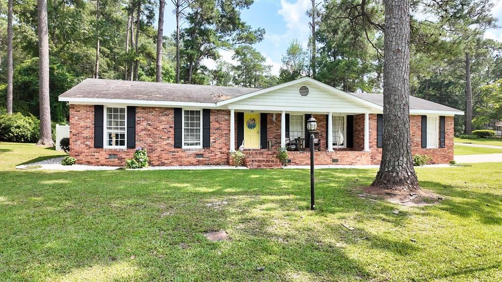 Welcome to this charming brick home offering 3 bedrooms, 2 bathrooms, and 1,841 square feet of comfortable living space, all on one level. Situated on a spacious lot this home combines functionality with plenty of room to enjoy both indoors and out. Inside, you'll find a blend of updated luxury vinyl plank flooring and beautiful hardwood floors throughout. The versatile floor plan features two separate living areas, including a generously sized family room with a cozy wood-burning fireplace, perfect for relaxing or gathering with family and friends. An office nook provides a convenient space for working from home or studying, while the formal dining room is ideal for hosting meals and special occasions. The kitchen is designed with both style and convenience in mind, offering ample cabinetry, abundant countertop space, and a breakfast bar with seating for three. Step outside to enjoy the back patio, an inviting space for grilling, entertaining, or simply unwinding in your fenced in backyard. A storage building provides additional space for tools, lawn equipment, or seasonal items. Don't miss your opportunity to make this wonderful home yours. Call today to schedule your private tour!