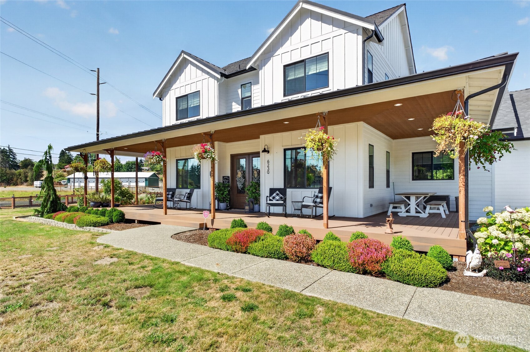 Stunning newer custom built modern farmhouse offering a total of 4,129sf of thoughtfully designed living space! Including a 686sf ADU with its own mini split, adding incredible versatility and a consistent rental history of $2,000/month. The open concept layout features soaring ceilings and expansive sliding glass doors that open to the backyard, creating a seamless flow between indoor and outdoor living. The main floor primary suite offers comfort and privacy with a spa like bathroom that includes a large soaking tub and fully enclosed steam  shower. Thoughtful custom touches include a wet bar, oversized walk in pantry, and dedicated dog washing station. Built for entertaining, the beautiful back patio and deck feature a convenient outdoor half bath - perfect for gatherings without guests needing to head inside. Modern farmhouse charm, custom details, fantastic entertaining spaces, and income producing potential or multi-generational use make this property a truly special find!