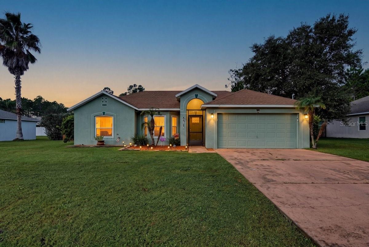 Welcome to this beautiful 4-bedroom, 2-bathroom home in Palm Coast, Florida, offering 1,730 square feet of living space, a spacious 2-car garage, and a fantastic outdoor living area! Built in 2004, this well-maintained Florida home combines comfortable living, an open floor plan, and inviting indoor and outdoor spaces. Step inside to discover a bright and spacious living area featuring vaulted ceilings, wood-look flooring, and an open-concept layout that flows seamlessly into the dining area and kitchen. The kitchen features stainless steel appliances, granite countertops, abundant wood cabinetry, a breakfast bar, and ample counter space, making it ideal for everyday living and entertaining.The spacious primary bedroom offers plenty of room to unwind, a ceiling fan, and a private en-suite bathroom. Two additional bedrooms provide flexible space for family, guests, or a home office. Additional interior highlights include ceiling fans throughout, generous closet space, an indoor laundry area, and an attached 2-car garage offering extra storage and convenience. Enjoy Florida's beautiful weather from the screened-in back porch, perfect for relaxing, entertaining, or enjoying your morning coffee. Step outside to a spacious backyard featuring a wooden deck built in 2022, a fully fenced yard, and plenty of green space for outdoor activities, pets, or gardening. The generous backyard provides an inviting setting for weekend gatherings and outdoor enjoyment. Located in Palm Coast, FL, this single-family home offers convenient access to shopping, dining, parks, golf courses, walking and biking trails, and the beautiful beaches of Flagler County. Enjoy the relaxed Florida lifestyle while remaining close to everyday conveniences. Whether you're searching for a primary residence, a Florida retirement home, or a property with exceptional outdoor living space, this 3-bedroom Palm Coast home with a fenced backyard, screened porch, and 2-car garage offers comfort, functionality, and room to enjoy the Florida lifestyle. Schedule your private showing today!