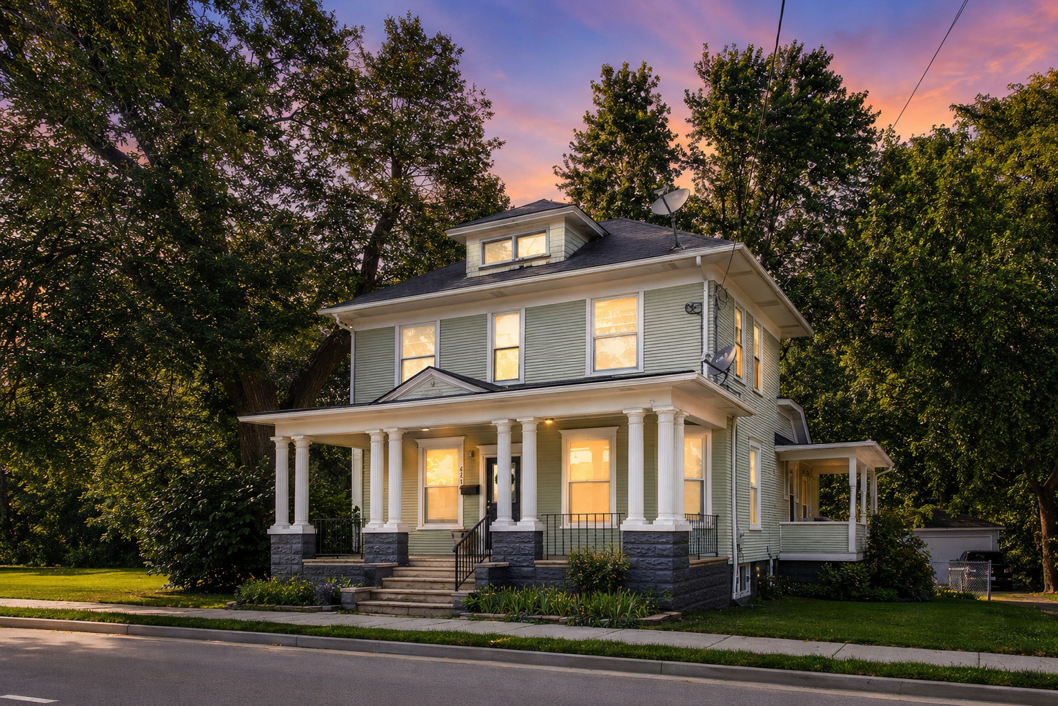 Move-in ready, updated kitchen, refinished hardwood floors, flexible living spaces, and over 2,900+ square feet (including basement). This beautifully maintained historic home offers the perfect blend of timeless character and modern functionality. From the moment you arrive, the stately wrap-around front porch welcomes you inside, where stunning original woodwork, built-in details, rich Craftsman trim, and a beautifully crafted staircase showcase the home's enduring charm.    Designed for today's lifestyle, the spacious main level features three separate living areas, a formal dining room, and a versatile main-floor bedroom that can easily serve as a home office, guest room, playroom, or additional family room. The updated kitchen offers abundant cabinetry, generous prep space, and opens to the home's entertaining areas, making gatherings both comfortable and convenient.    Upstairs, you'll find two generously sized bedrooms, while the expansive basement adds incredible flexibility with multiple finished spaces ideal for a recreation room, fitness area, hobby room, workspace, or additional storage. Whether you're entertaining guests or simply need room to spread out, this home offers space for every stage of life.    Outside, enjoy your morning coffee on the inviting wrap-around porch, host summer cookouts on the deck or brick paver patio, and relax in the private, tree-lined backyard backing to city-owned open space with no direct neighbors behind. A detached two-car garage completes the property.    Conveniently located just minutes from downtown Elgin, Metra, I-90, shopping, dining, parks, and everyday conveniences, this move-in ready home delivers the character buyers love with the space and versatility they rarely find.