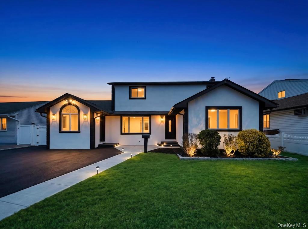 Welcome home to this impeccably updated 4-bedroom, 3-bathroom residence, where every detail has been curated for modern living. From the moment you step into the formal foyer, you’ll notice the seamless blend of sophisticated design and functional upgrades. The heart of the home features a bright, open-flow kitchen with premium finishes, a reliable oil heating system, and a modern electric stove for precision cooking, leading into not one, but two spacious family rooms—perfect for entertaining or creating a dedicated home office/playroom. The primary bedroom is a true retreat, boasting two closets (including a convenient, slight walk-in) and dual access to the bathroom—accessible directly from the suite or the hallway for maximum convenience. Enjoy the warmth of new hardwood floors throughout the second level and sleek, modern tiling on the lower floors. A massive, bright lower level with high-end tile flooring offers endless possibilities for a gym, theater, or recreation space. Stay cool with brand-new AC units installed in every room, ensuring personalized comfort throughout the home. Peace of mind comes standard with a new electrical panel and a roof that is only one year old. The entire home is illuminated by elegant recessed lighting, creating a bright and airy ambiance in every corner. Provides plenty of parking and leads to a beautifully maintained exterior with a spacious, manicured backyard. Move-in ready and meticulously maintained, this home offers the perfect balance of luxury upgrades and suburban tranquility.