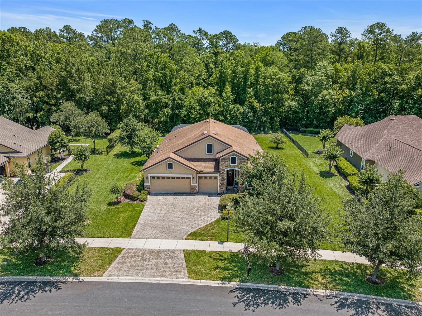 ASSUMABLE 2.99% VA LOAN FOR QUALIFIED BUYERS!!  RUN, DON'T WALK TO SEE THIS HOME!!! Welcome TO 2064 Crown Drive in gorgeous St. Augustine, Florida.  This 3 bed+office, 3 bath estate pool home is nestled in the private and highly sought after King & Bear community in World Golf Village!  Ideally located on an oversized serene conservation lot, this well-maintained residence offers 2,645 sqft of thoughtfully designed living space.  Experience resort-style luxury in your own backyard with a custom-built saltwater pool and spa complete with waterfall and water features-screen enclosed, gas heated, and fully remote controlled for effortless enjoyment.  Travertine tile flooring and covered seating area further enhance the outdoor living space.  Inside you'll find tile floors throughout the main living areas, rich wood flooring in the bedrooms, and a versatile split floorplan.  The spacious primary suite features crown molding, built-in California Closets, and a spa-like en suite bath with an oversized shower and luxurious finishes.  Double doors open to a flexible 4th bedroom/office ideal for work or guests.  A huge formal dining/flex room offers even more living space to customize for your lifestyle.  The chef's kitchen is equipped with granite countertops, stainless steel appliances, center island.  Off the kitchen enjoy a full eat-in kitchen area with built-in dry bar and wine fridge perfect for entertaining.  Additional highlights include: 3 car garage with Shark floor coating, plantation shutters and custom blinds throughout, full house water softener, and laundry room with utility sink and overhead storage cabinets.  Enjoy the unmatched amenities of King & Bear, including two championship golf courses, one just recently renovated.  Two resort-style pools, tennis, pickleball, dog park, clubhouse, on-site dining, and access to top-rated St. Johns County schools.  This immaculate home won't last-schedule your private tour today!