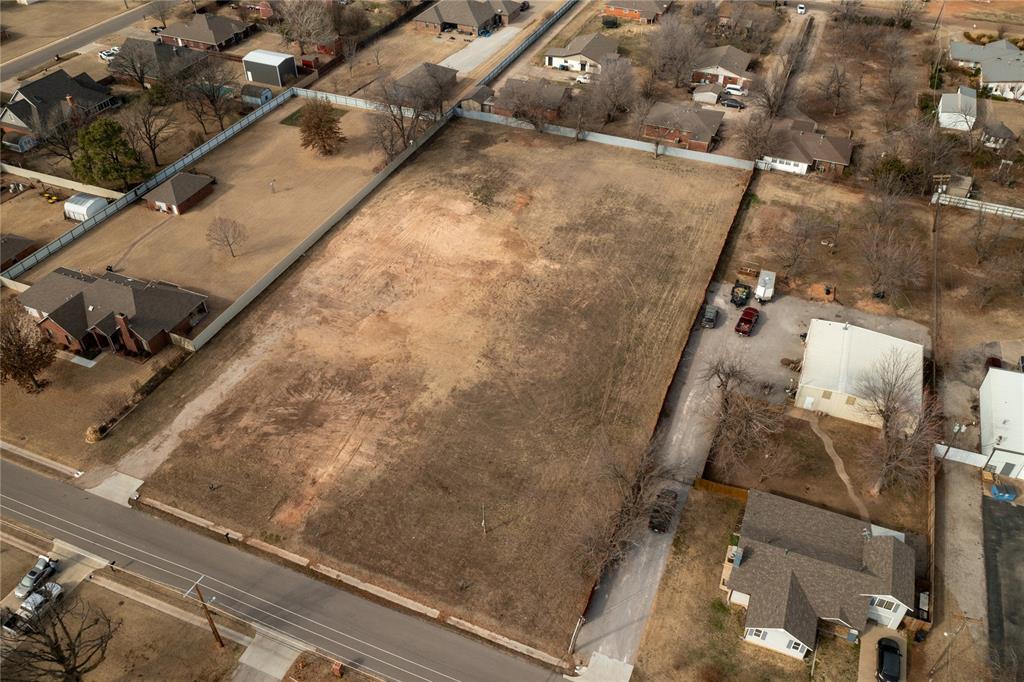 Rare opportunity in NW Moore!  Large 1.5 acre lot ready to build.  Partial fenced with metal fencing on one side and across the back, Wood fencing on the other side. Build your dream home  or split the lot and build two homes! Shops are also allowed! Plans must be approved by city. Moore utilities.  Quiet, established neighborhood on the border of N Moore/S OKC.  Close to major highways, popular restaurants, and Downtown OKC.