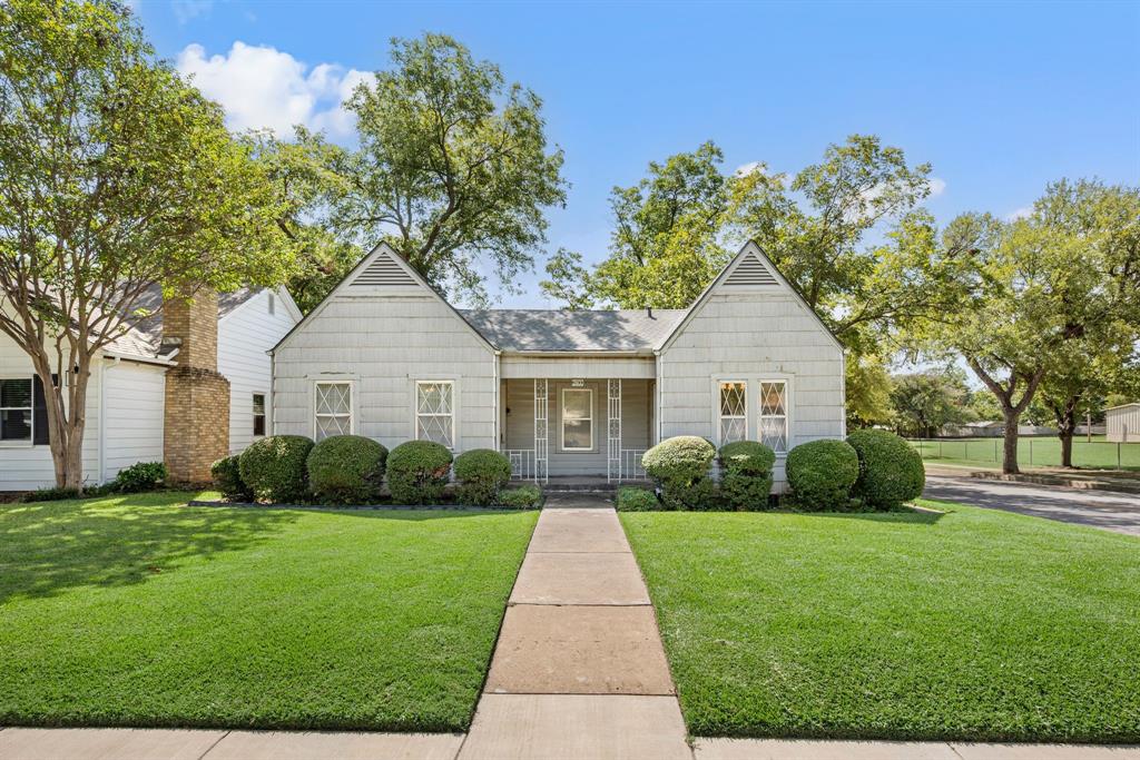 Brimming with vintage charm, this 1939 Fort Worth 2-bedroom, 1-bath home sits on a spacious corner lot just a short stroll from Amon Carter Riverside High School, Oakhurst Elementary, and the Fort Worth Riverside Library. Classic details—kitchen window seat, original glass door knobs, and a nostalgic phone niche—highlight its timeless character, while abundant natural light creates a welcoming atmosphere. A detached garage and outbuilding provide excellent potential for a workshop, studio, or extra storage. Full of history and perfectly placed for walkable convenience, this gem is ready for its next chapter.