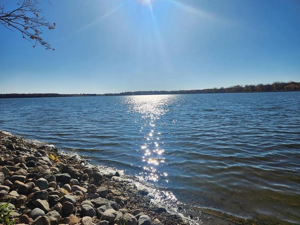 Make new memories while relaxing and watching Beautiful Sunsets on Clear Lake.  The 24 x 10 deck and firepit area are ideal for capturing lake views and taking in the sun.  Improvements include an updated kitchen, light fixtures, hard surface flooring, sidewalk, & spray foam insulation in the crawl space. The garage is also insulated and heated. Another feature is the maintenance-free exterior on the home, garage, and storage shed.  This home has income-earning potential as it is currently being ran as a successful part-time Airbnb. When you’re not using it you could choose to capitalize on the additional income to pay for the property.  Awesome location, setting, and investment opportunity.