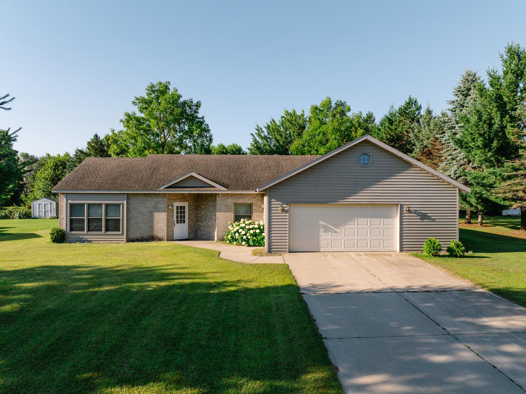 Enjoy easy one-level living in this solid and beautifully cared-for 3-bedroom, 2-bath patio home nestled on just under an acre in a desirable cul-de-sac on the outskirts of Long Prairie. From the moment you arrive, you'll appreciate the excellent curb appeal and welcoming neighborhood. The open floorplan is highlighted by vaulted ceilings, creating a bright and spacious feel throughout the main living areas. The primary suite offers a private retreat with walk-in closet and en suite bath. The heated and insulated attached garage provides ample space for vehicles, hobbies and storage while the additional detached garage/storage building adds even more versatility. Step outside to enjoy the beautifully maintained yard and relax in the gazebo, an ideal spot for morning coffee or evening gatherings. With a spacious lot, extra storage and thoughtful amenities throughout, this move-in-ready home is ready to welcome its next owners!