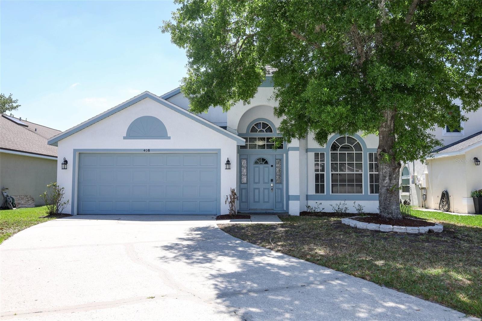 Welcome to 408 Lexingdale Drive in Bradfordt Village at Waterford Lakes, where thoughtful updates, generous living spaces, and a beautifully connected lifestyle come together. Refreshed and ready for its next owner, this move-in-ready home offers the comfort, flexibility, and setting today’s buyers are looking for in one of East Orlando’s most established and desirable communities. From the moment you step inside, soaring ceilings and a bright foyer create an inviting introduction. The layout unfolds with an easy, natural flow designed for both everyday living and entertaining, beginning with a versatile front study that can serve as a home office, playroom, library, or formal flex space. Spacious dining areas offer room to gather and host with ease, while the kitchen with newer appliances serves as the heart of the home, opening to the family room and breakfast nook for a seamless connection between daily routines and special occasions. The split-bedroom floor plan offers privacy and functionality, making the home especially appealing for anyone needing flexible space. The primary suite creates a quiet retreat with a beautifully refreshed bath featuring updated vanities, sinks, mirrors, plumbing fixtures, and a new shower and resurfaced tub completed in 2026. The secondary bathroom was also refreshed in 2026 with a new vanity, sinks mirror, and plumbing fixtures. Fresh interior paint in 2026 enhances the light and clean feel throughout, while major improvements including AC 2025, roof 2025, replumb 2026, fence 2025, and new cyclospartic garage floor coating by Garage Force 2026 provide meaningful value and peace of mind. Out back, the lifestyle continues with a tiled and screened lanai that creates a comfortable outdoor living space for morning coffee, weekend gatherings, or peaceful evenings at home. The fenced backyard opens to tranquil waterfront views, offering a serene backdrop and a sense of openness that makes the property feel even more special. Living in Waterford Lakes means access to amenities that truly enhance everyday life, including a resort-style pool, playground, tennis courts, basketball courts, baseball fields, and scenic walking paths. Bradfordt Village enjoys the benefits of this sought-after community while being close to shopping, dining, parks, top daily conveniences, and major roadways for easy access across East Orlando. This is a home that has been prepared with intention, offering space to gather, room to grow, and a setting that makes coming home feel special. Schedule your private tour today