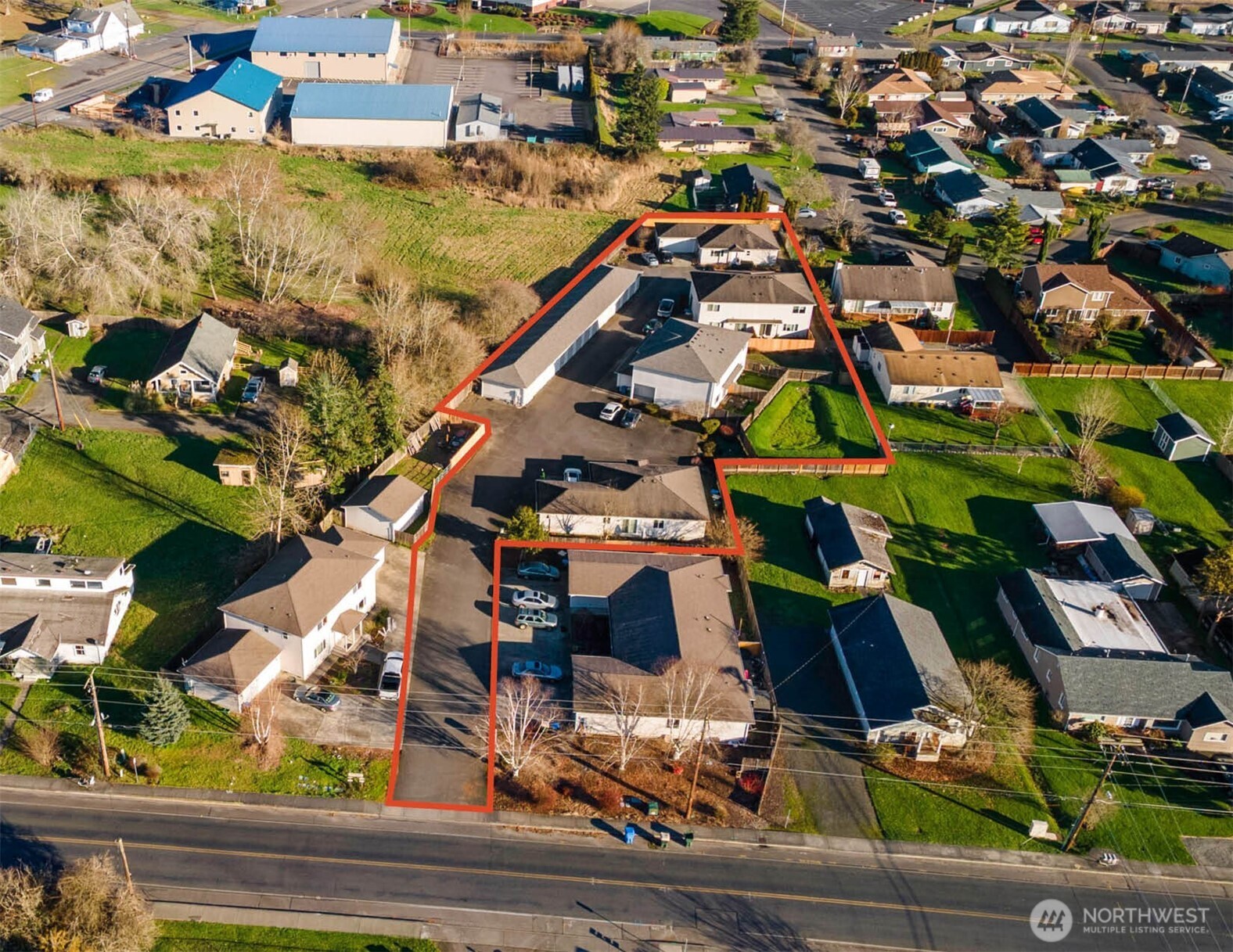 Madlen Court Rental Homes & Self-Storage blends highly desired single-family type rental homes with the additional benefit of self-storage. Featuring 6 single-family style rentals (all 3BR/2BA, ~1,400 SF avg) plus 14 self-storage units. Tenants pay 100% of utilities; homes feature two-car garages, modern construction, and newer roofs—built for low-drama ownership. The tucked-away, off-street setting is walkable to Chehalis schools, Boys & Girls Club, parks, and athletic facilities, and is less than 10 minutes to I-5 and downtown. Chehalis sits almost exactly halfway between Seattle and Portland on the I-5 corridor, and the market’s recent positive economic activity include an announced Amazon operations facility projected at 500–1,000 jobs and the PSE takeover of the TransAlta power plant creating an estimated 700 jobs. There are two investment approaches an investor can take. Raise residential rents and push storage rents toward market. There is an estimated 87% increase feasible for storage based on rent comps. Alternatively, an investor can add additional units based on 24 du/acre density zoning for the property. Also, an investor subdivide and sell the residential units individually for a profit and keep the storage for pure cash-flow.