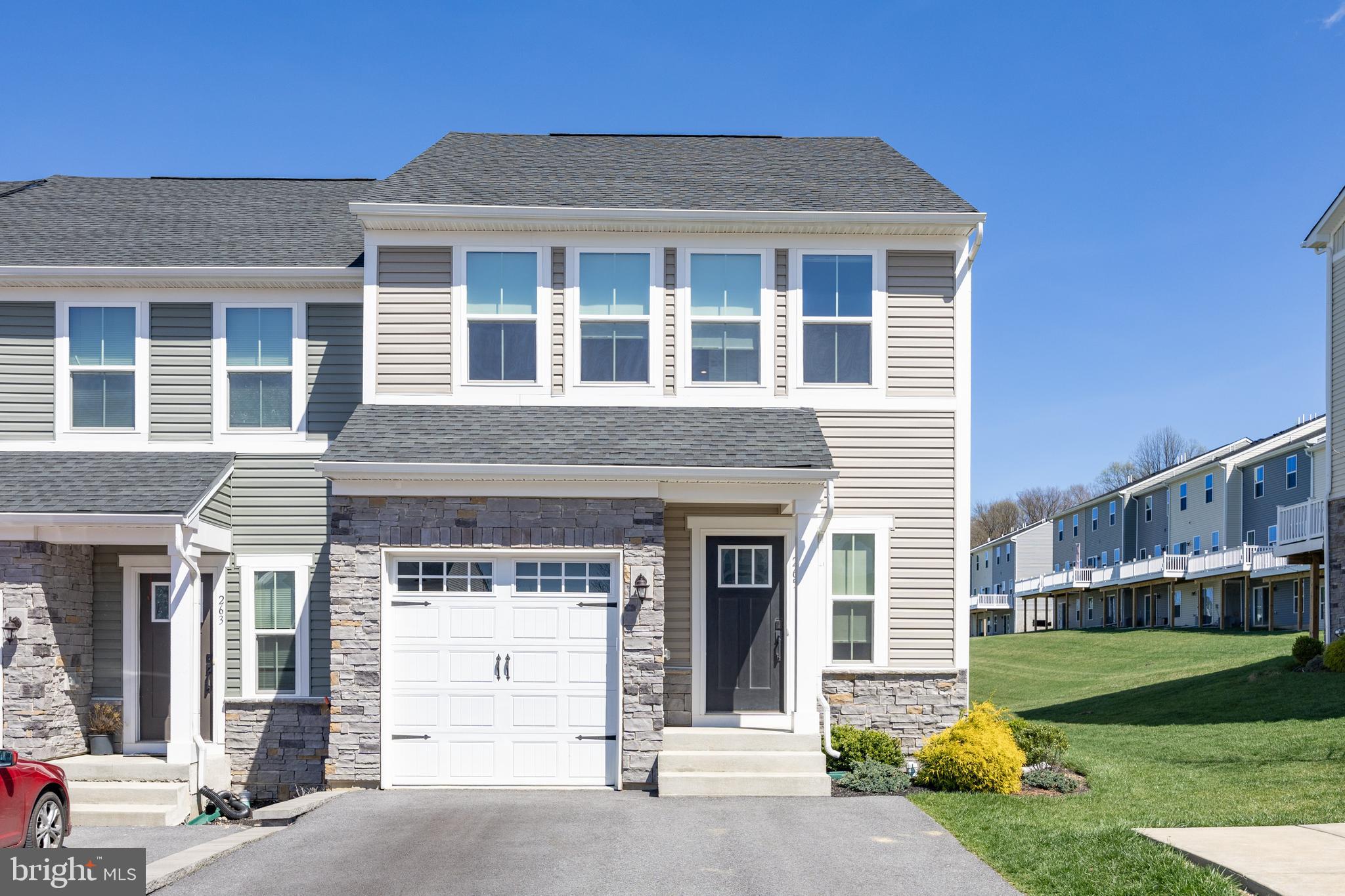 Welcome to Highpoint at Downingtown, one of Chester County’s most sought-after communities. This nearly new, end unit, townhome offers 3 bedrooms, 2.5 baths, and a thoughtfully designed open-concept layout with stylish upgrades throughout.The main level features a stunning kitchen with white shaker cabinetry, quartz countertops, tiled backsplash, stainless steel appliances, and a large 8' center island, all flowing seamlessly into the dining area and great room. Luxury vinyl flooring runs throughout, and sliding doors lead to a spacious composite deck overlooking one of the best lots in the neighborhood overlooking open space.Upstairs, the primary suite includes a walk-in closet and a spa-like bath with dual vanity and walk-in shower. Two additional bedrooms, a full hall bath, and a convenient second-floor laundry room complete this level.The fully finished basement adds flexible living space, ideal for a home office, gym, or guest suite.Located in the award-winning Downingtown Area School District and just minutes from Wegmans, Routes 202 and 30, the Downingtown STEM Academy, and the train station. Just 4 years young and in a sold-out community, this move-in ready home offers the perfect blend of location, lifestyle, and low-maintenance living.
