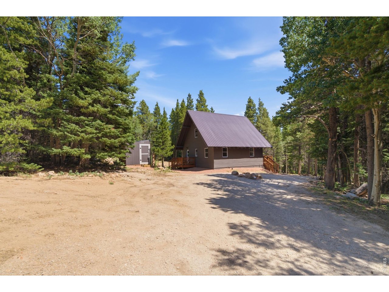 Some cabins ask you to bring a toolbox. This one asks you to bring hiking boots, coffee, and a few people you'd like to disappear into the mountains with.Welcome to 225 Mills Moraine, a rare getaway cabin on 1.3 private acres near the boundary of Rocky Mountain National Park and the Longs Peak Trailhead. If your idea of a good day starts with fresh mountain air and ends on a quiet deck under the trees, this one speaks your language. For much of its life, this was a rarely used summer cabin. Now it has been completely reimagined for year-round use while keeping the original mountain character intact. The home was stripped down, raised up, placed on a new concrete foundation, and every inch has been remodeled. Updates include a new upstairs bathroom, new foundation, new plumbing, new laundry hookups, new windows, new doors, new flooring, new metal roof, new wood stove, and a new storage shed. Inside, the layout is simple, warm, and easy to enjoy. The main level includes a bedroom, bath, kitchen, and living room with a wood stove for cozy evenings after a long hike. Upstairs, two spacious bedrooms and a new bathroom offer room for guests, loved ones, or quiet retreat space, with added storage tucked under the eaves. Outside, the setting does what mountain cabins are supposed to do. Morning coffee on the deck. Dinner overlooking the forest. A short walk to the Longs Peak Trailhead and ranger station. A full day exploring Rocky Mountain National Park, then back home to rest, reconnect, and let the woods go quiet around you. With district year-round water, inspected septic system ready to transfer, and no major renovation list waiting for the next owner, this is not just a cabin near the park. It is a ready-to-enjoy mountain basecamp. If you have been waiting for a private cabin that lets you skip the projects and get straight to the stories, this one is worth seeing before someone else starts leaving their hiking boots by the door.