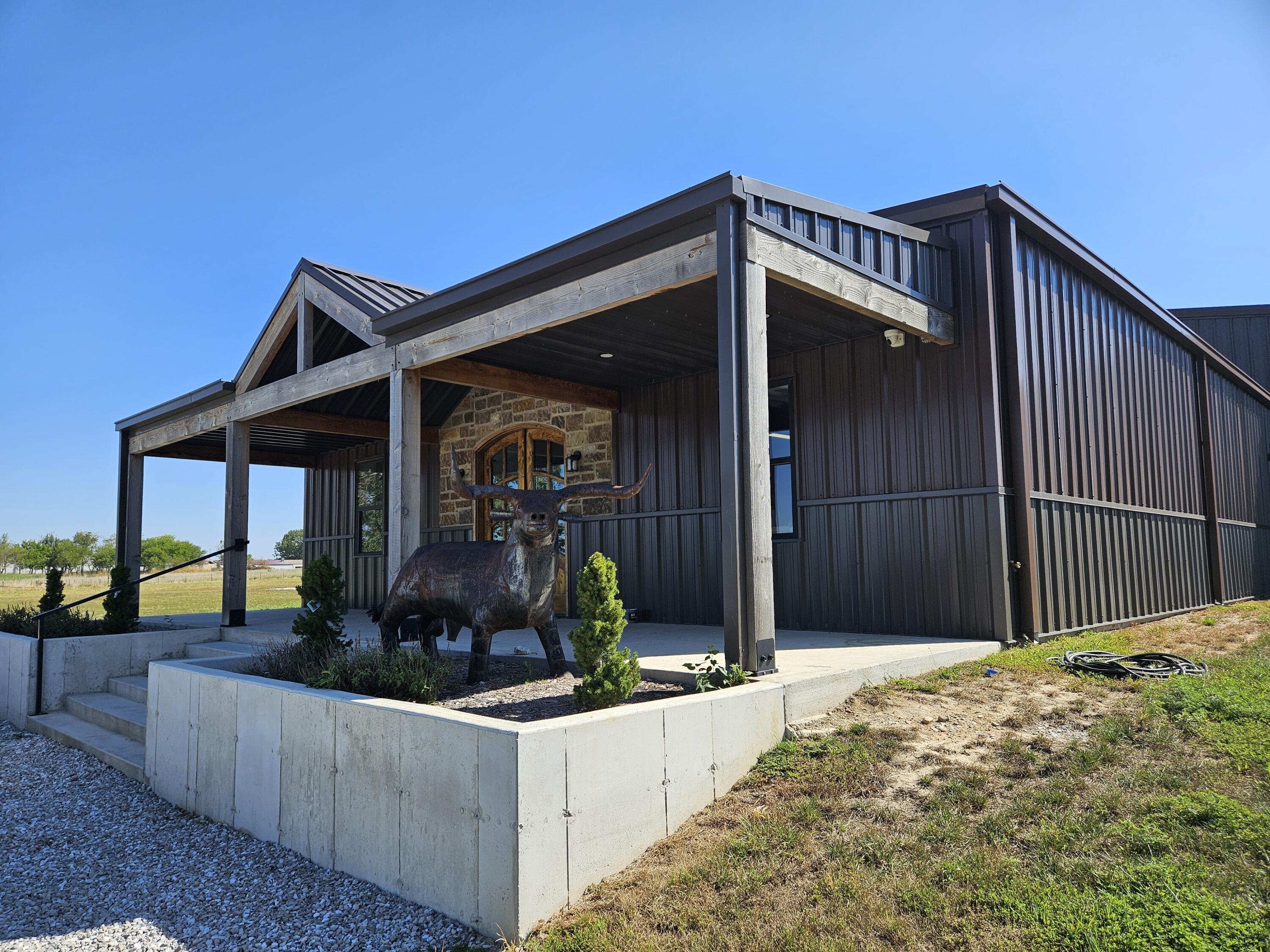 Amazing opportunity to own a large retail/warehouse/office space less than 20 minutes from Republic and only 30 minutes from Springfield.  This beautiful building is just a couple of years old and sits on over 17 lush mostly open acres.  The building is currently being used as warehouse and office space, but the approximately 2000 square foot space at the front of the building would be ideal for a retail area.  It comes complete with a bathroom and two changing rooms.  The warehouse space is approximately 9600 square feet and has two large office spaces both with split units for HVAC.  There is even storage above the offices and a shower area.  The warehouse has two ground level doors.  One is ten feet and the other is twelve feet giving you plenty of space to get products in and out.  At the back of the warehouse space there is a built in pickle ball court.  There is also a small kitchen/break room area and another bathroom in the warehouse.  This 17 acre property also includes a nice pond and there is even an opportunity to sell the hay to generate a little extra income.  Call today to come take a look at this amazing property.