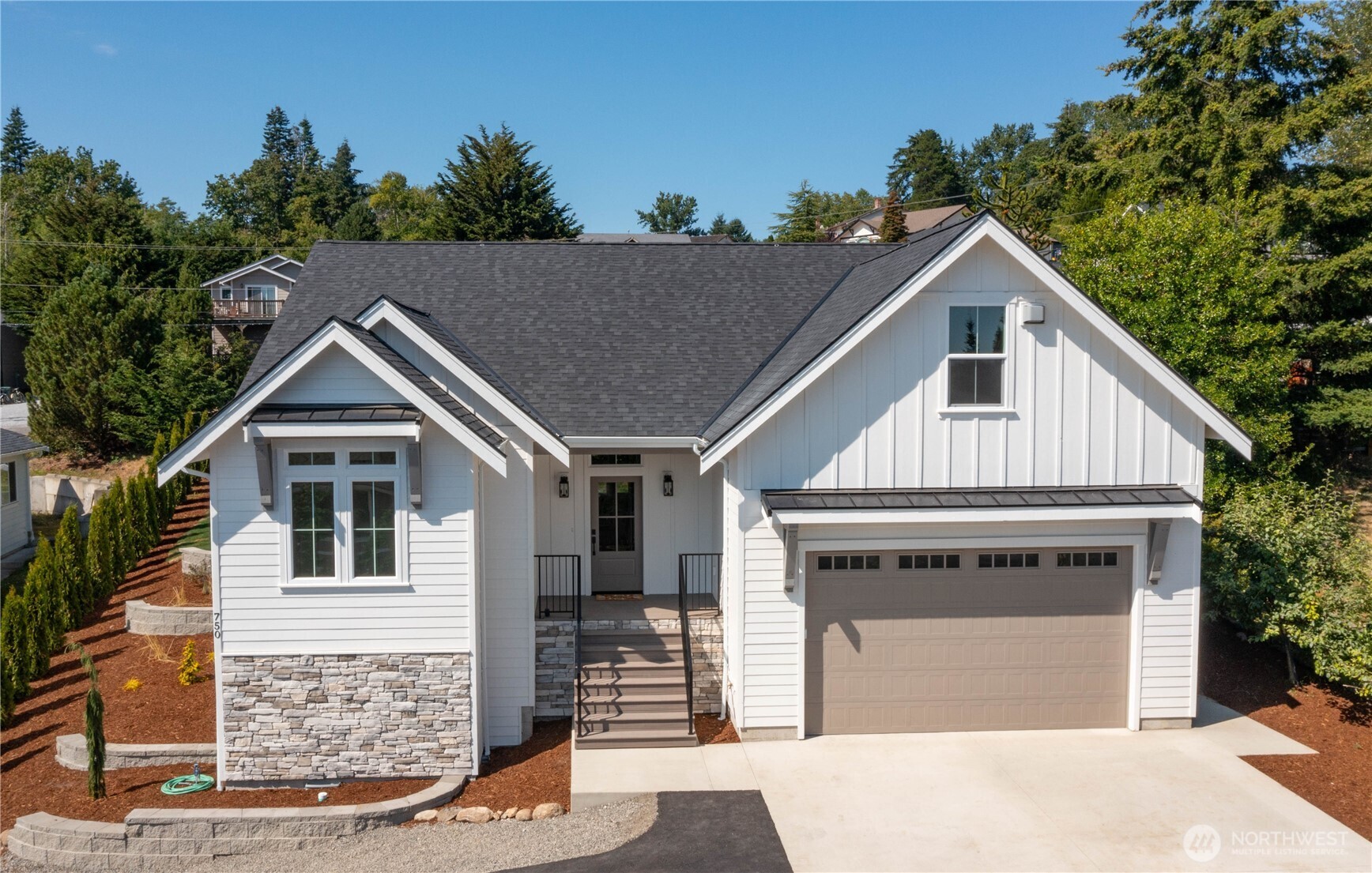 All done! Brand new one level home +bonus on over 9,000 sq ft lot in excellent city of Blaine location! Just minutes from heart of town, waterfront, historic shopping, I-5 access, parks & more - can't beat this infill lot location. Perched on extra-large town lot with beautifully terraced side yard and spacious private backyard. Well-designed selections in and out, this quality-built home will not disappoint. Inviting open floor plan with vaulted ceilings, cozy gas fireplace w/Scandinavian vibe & tons of windows to let in natural light. Kitchen with large eat-in island, timeless white cabinets, quartz counters, tile backsplash, & stainless-steel appliances. Warm toned Lux Vinyl Plank flooring throughout main living areas. Owner's suite tucked in back of home w/dual vanity, walk-in closet & large shower. Nice trex decking front porch & back patio. Great size bonus room perfect flex space with peek-a-boo water views! See mood boards in pics for planned finishes. Should be done just in time to close on this beautiful new home! Lot size also lends to potential DADU uses.